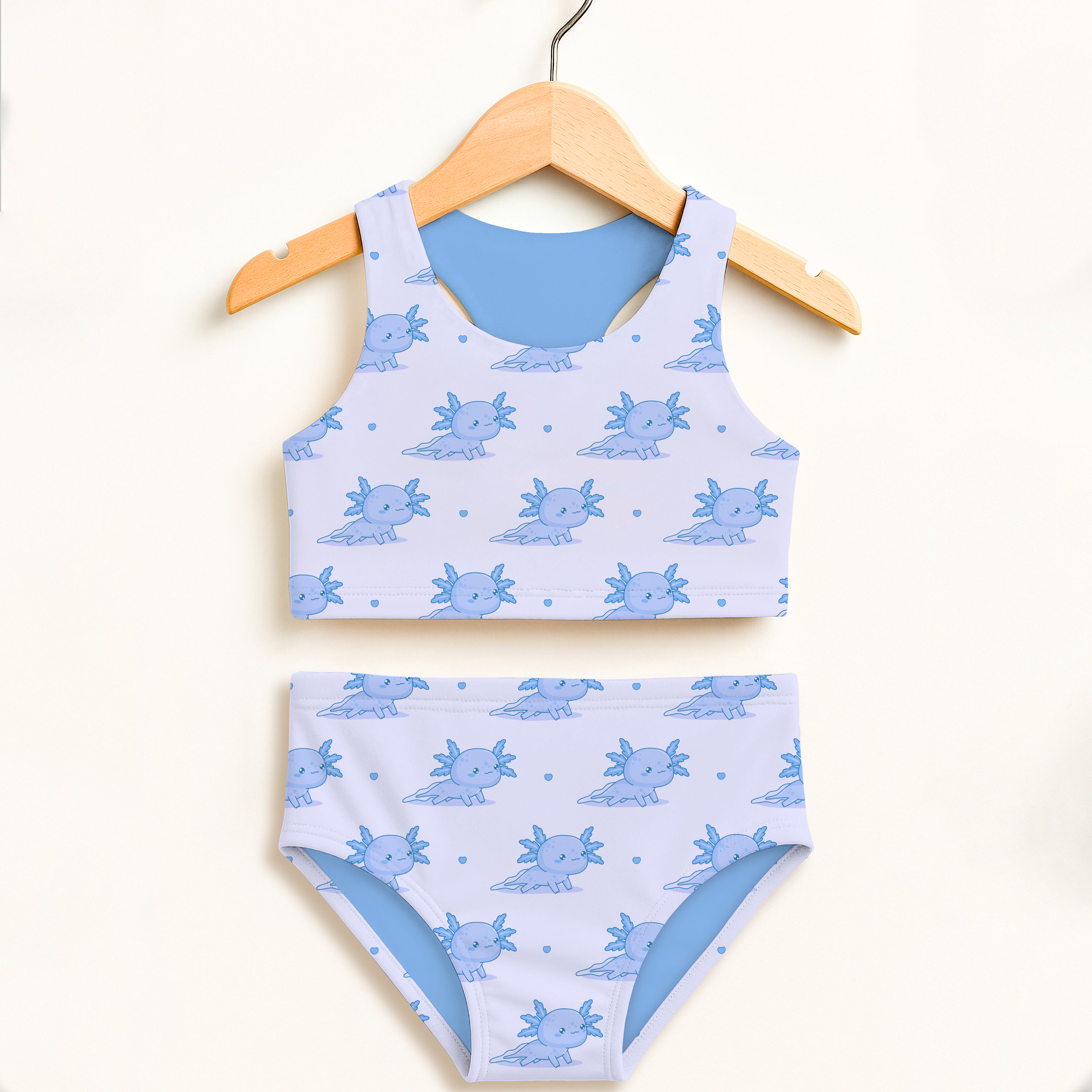 Girls blue axolotl two-piece swimsuit with white base light blue lining double layered upf 50+ high waisted comfort