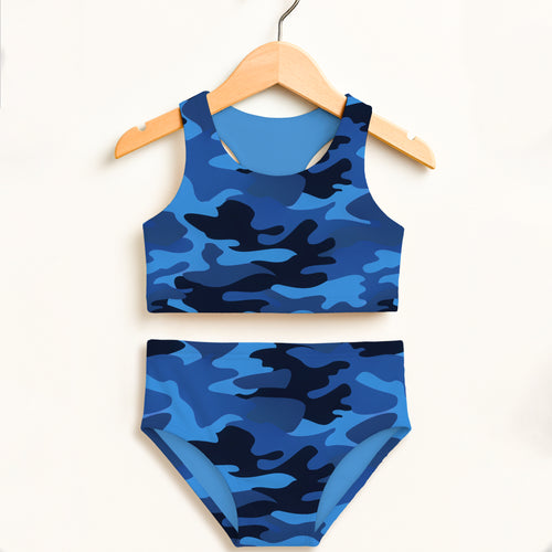Girls dark blue and black camouflage two piece swimsuit with double layered fabric and upf 50 plus protection hanging on wooden hanger