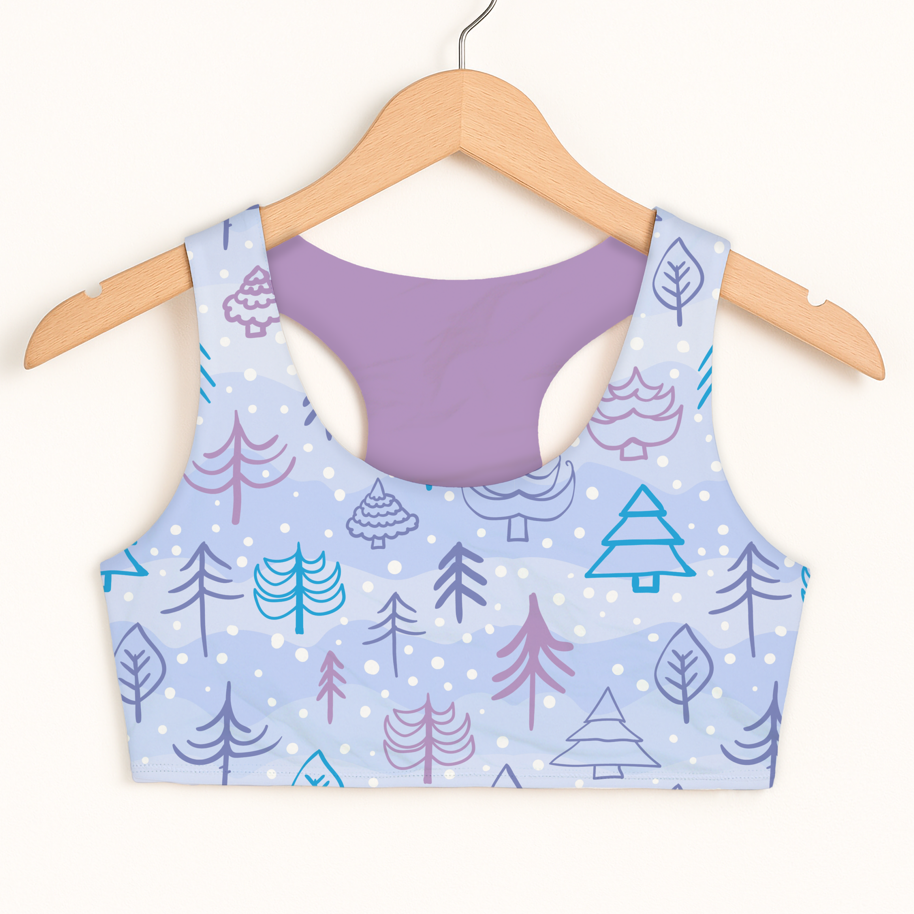 Girls blue Christmas tree sports bra with quick drying fabric double layered comfort and playful tree leaf pattern