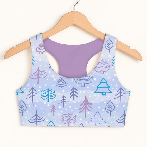 Girls blue Christmas tree sports bra with quick drying fabric double layered comfort and playful tree leaf pattern