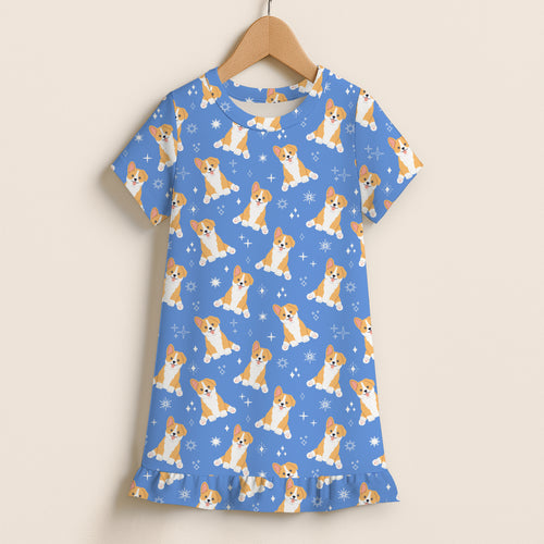 Girls blue short sleeve nightgown with playful orange and white corgi dog pattern and star accents on wooden hanger
