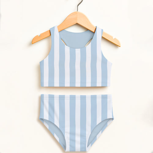 Girls blue stripe two piece swimsuit with light blue and white stripes hanging on wooden hanger featuring upf 50+ protection