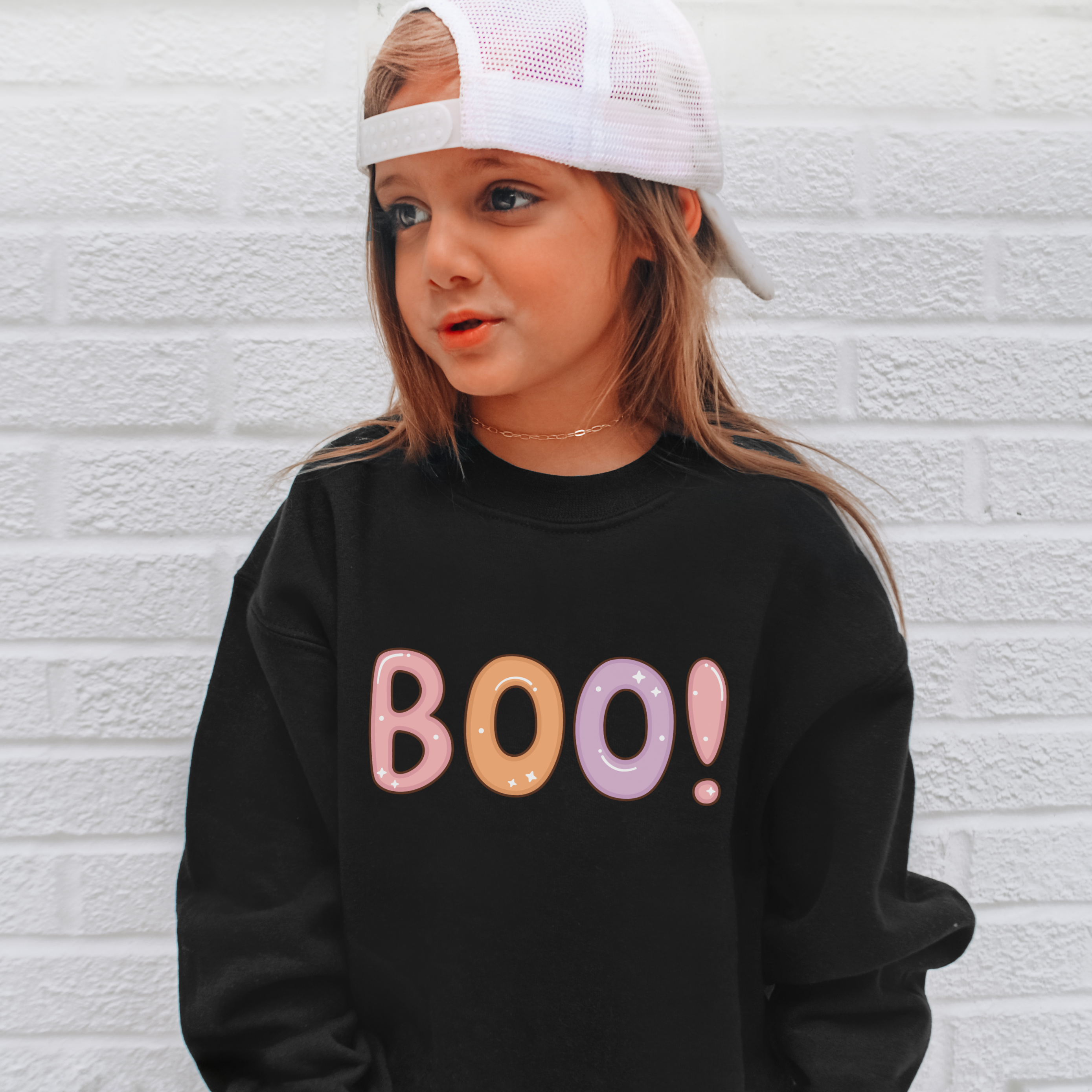 Black long-sleeved kids boo halloween sweatshirt with pastel pink orange lavender sparkly lettering pullover