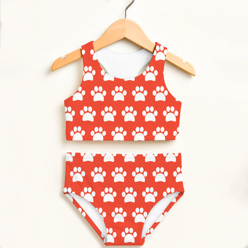 Girls bright orange two piece swimsuit with red and white paw print pattern double layered upf 50 high waisted comfort