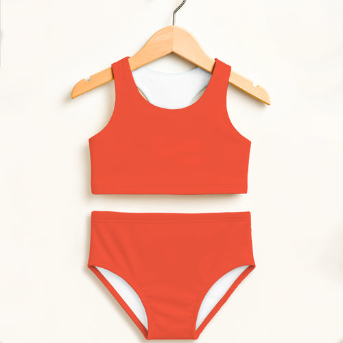 Girls bright orange two piece swimsuit with double layered upf 50 plus high waisted design and white inner lining