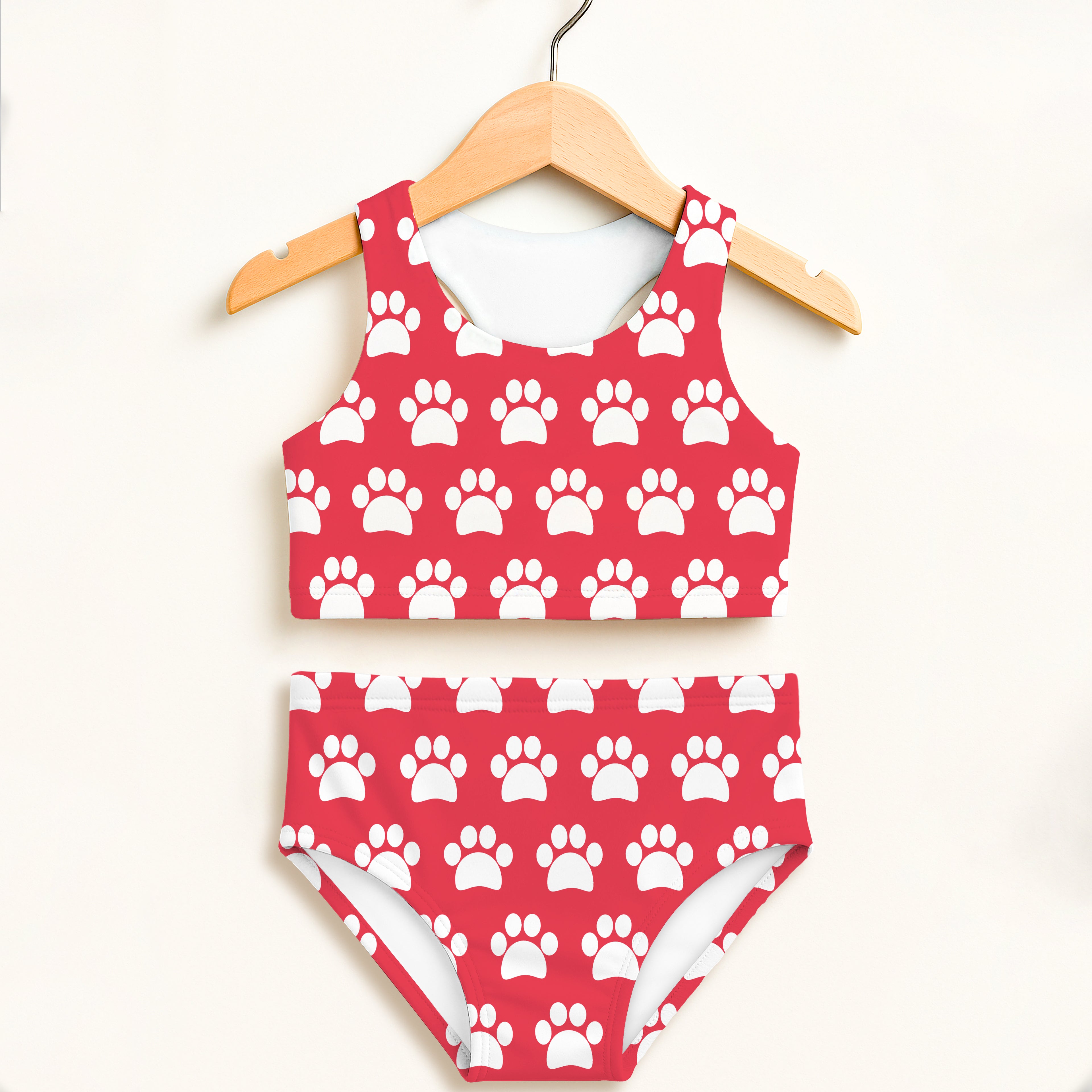 Girls bright pink paw print two piece swimsuit with halter top and high waisted bottoms upf 50 plus comfort