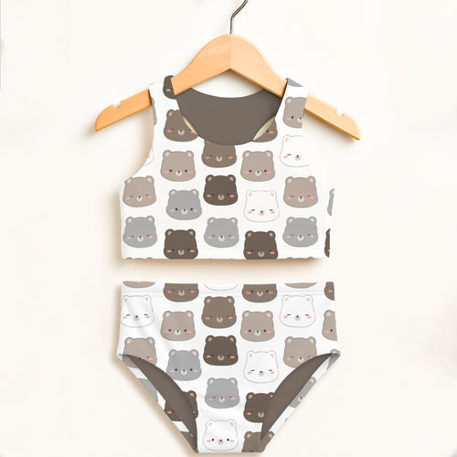 Girls brown bear two piece swimsuit in white with playful cartoon bear pattern and double layered upf 50+ fabric