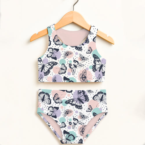 Girls butterfly two piece swimsuit with black outlined butterflies mint and blush splashes on white double layered upf 50+
