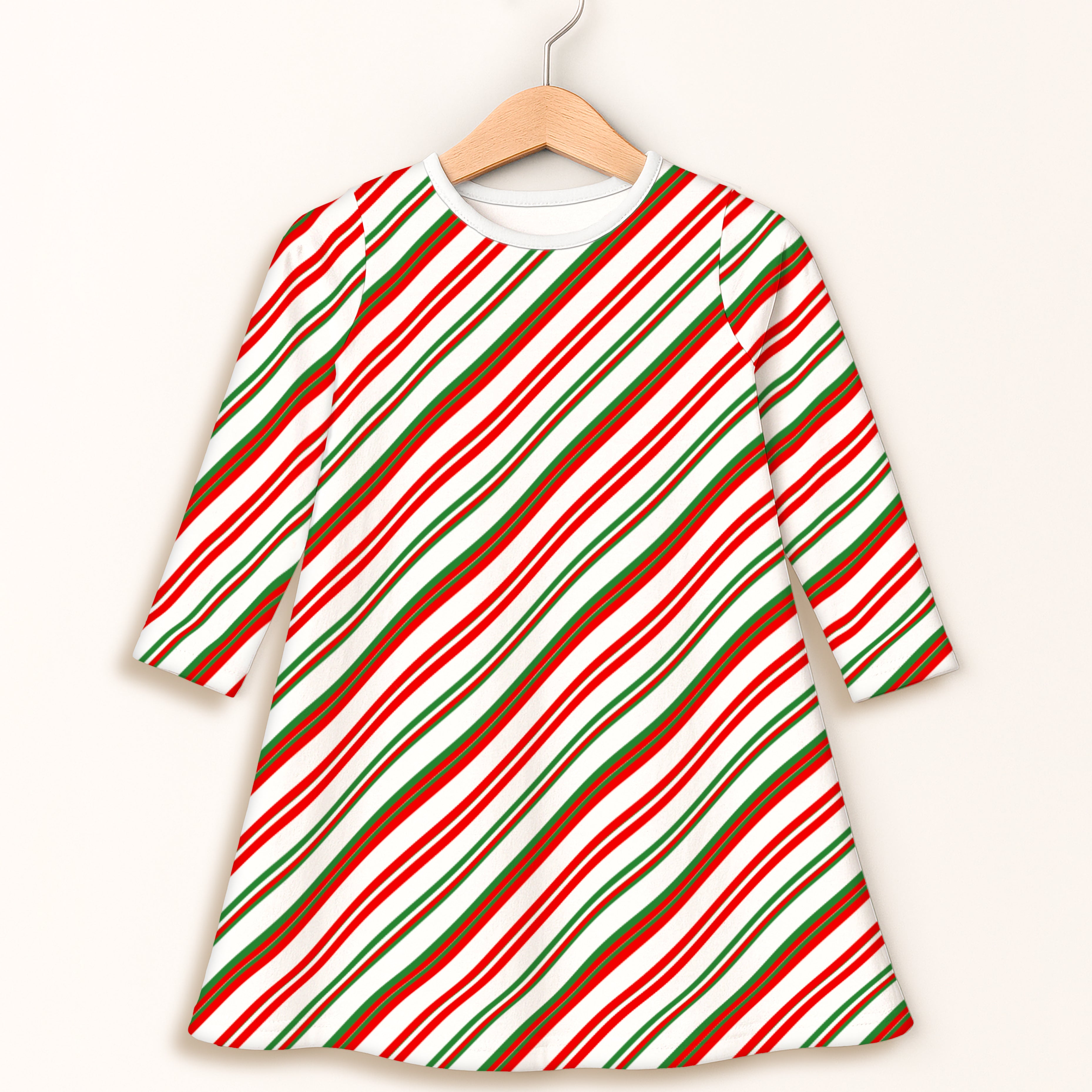 Girls candy cane long sleeve dress with festive diagonal red green and white stripes in a comfortable a-line fit