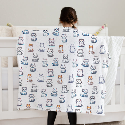 Girls cat pattern blanket white fleece featuring a playful pattern of cartoon cats in white gray orange and blue