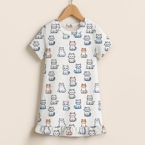 A white short-sleeved nightgown with colorful cartoon cat patterns and ruffle hem for girls