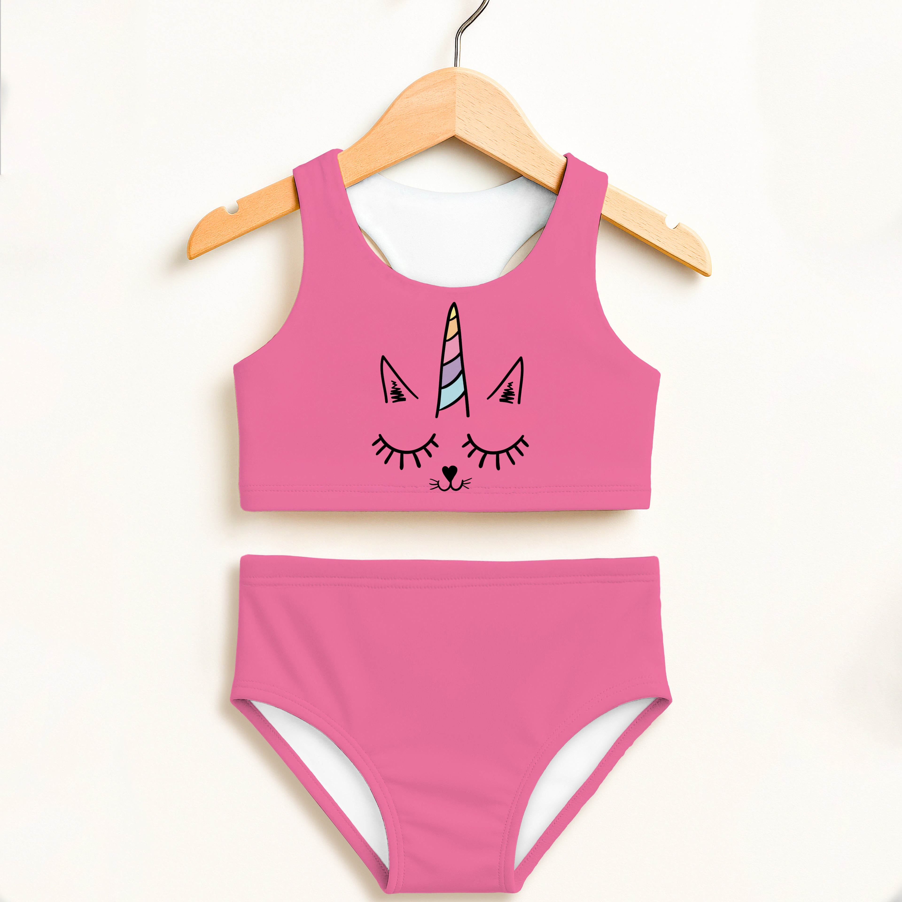 Girls caticorn two piece swimsuit in pink with colorful horn and closed-eye design, double layered UPF 50+ high waisted comfort