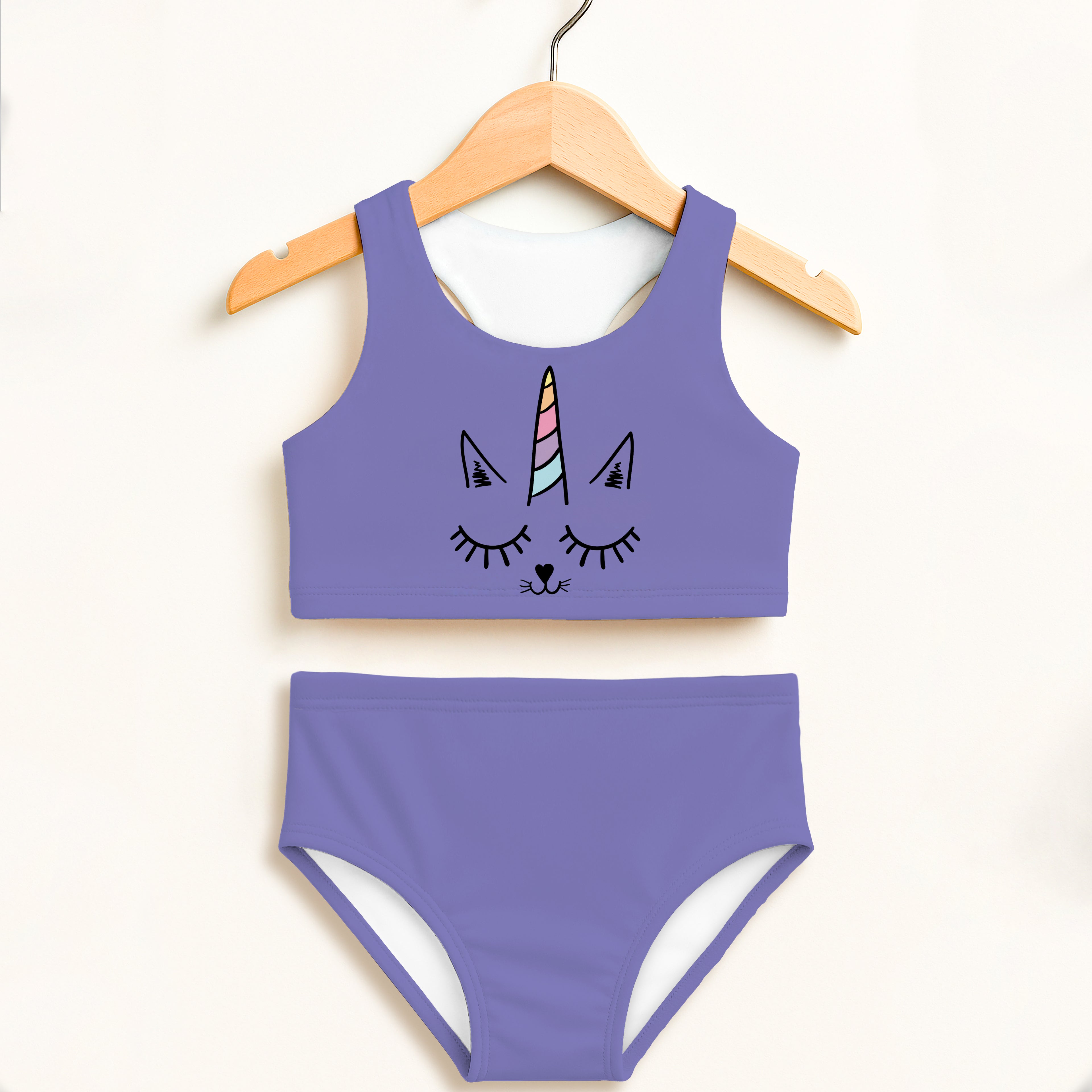 Girls caticorn two piece swimsuit in purple with unicorn horn and closed eyes design double layered UPF 50+ fabric
