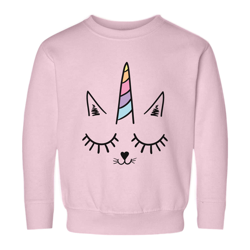 Pink girls caticorn sweatshirt featuring a cartoon unicorn cat face with rainbow horn and black outline details