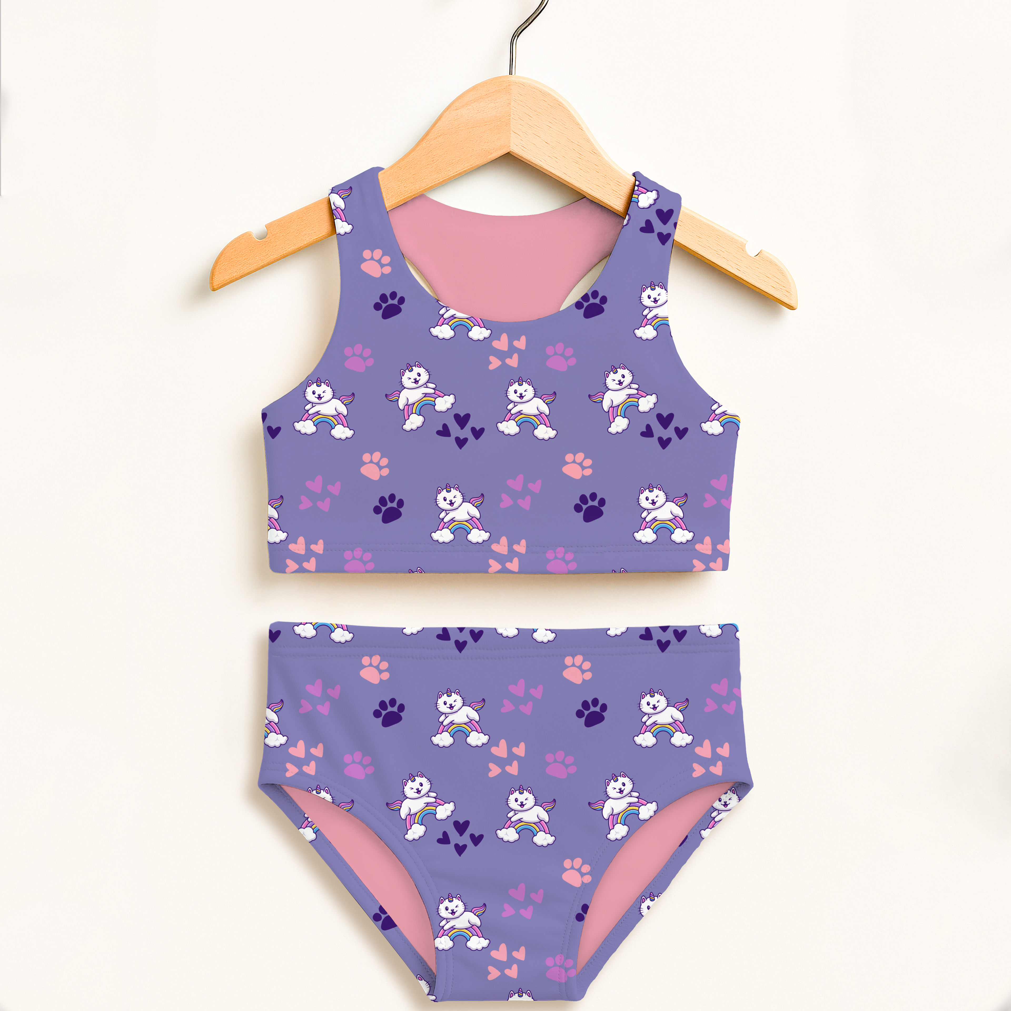 Girls purple caticorn two piece swimsuit with pink lining and rainbow paw prints featuring UPF 50+ high waisted comfort