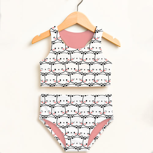 Girls cat print two-piece swimsuit with white fabric pink lining black outlines and double layered UPF 50+ protection