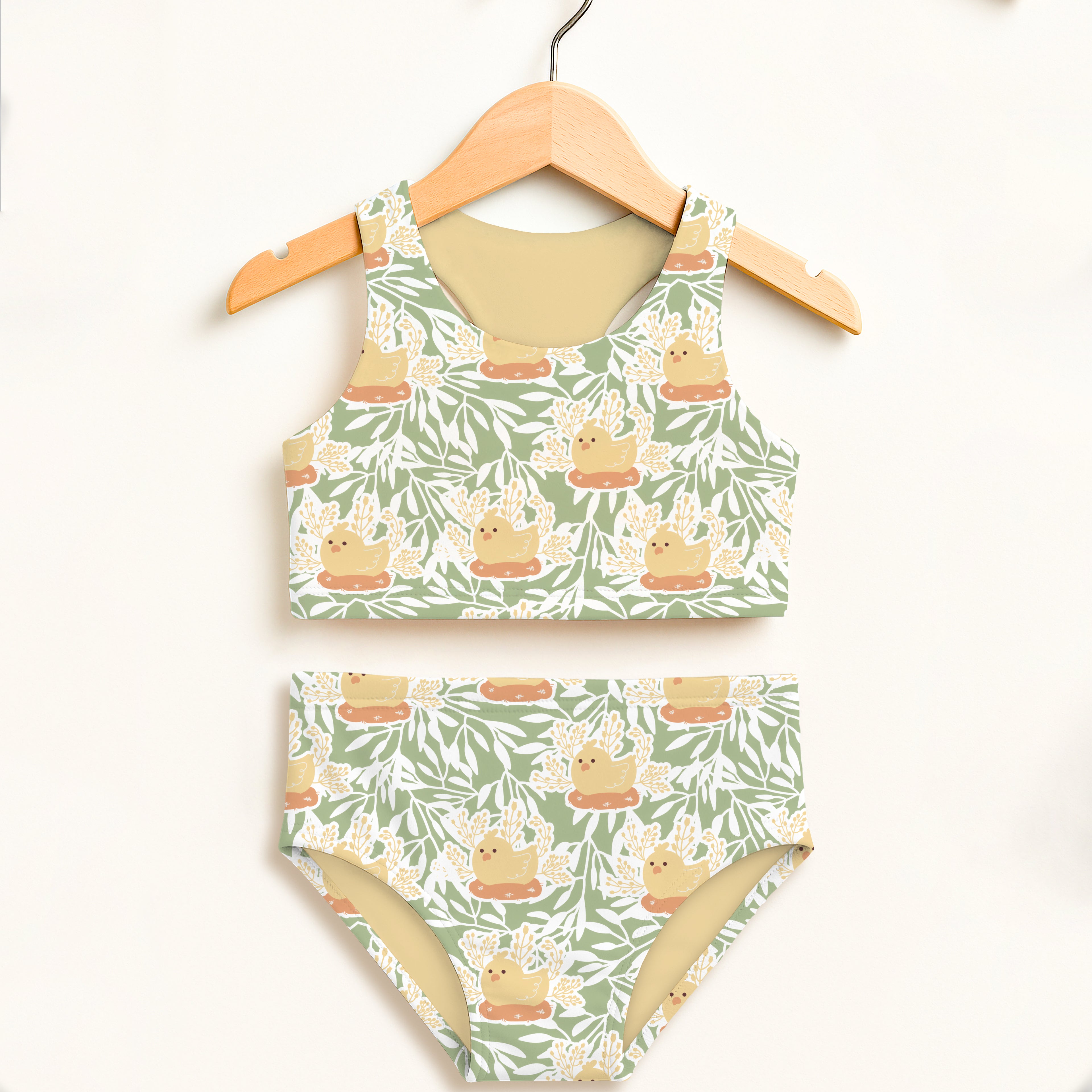 Girls sage green chick two piece swimsuit with double layered upf 50 high waisted comfort and yellow rubber duck pattern