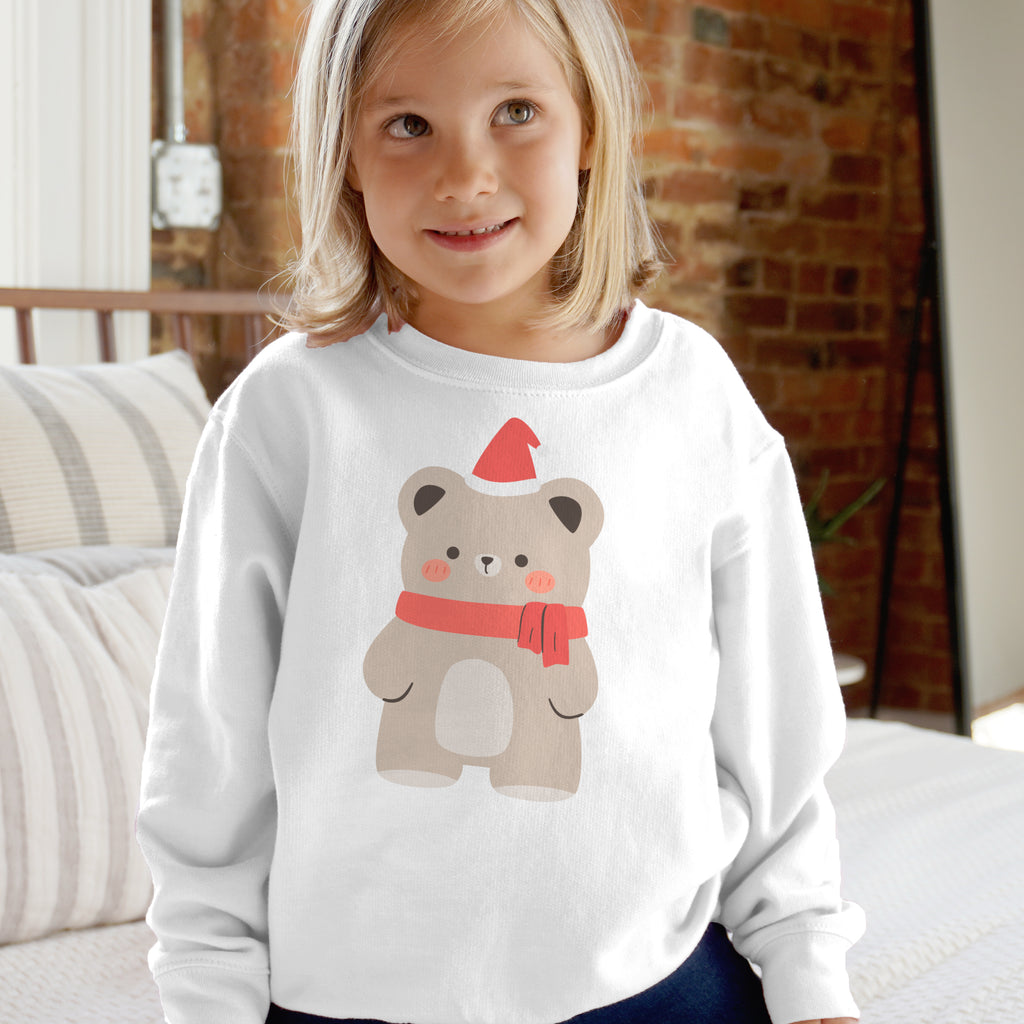 White long-sleeved fleece sweatshirt with a beige bear wearing a red santa hat and scarf for kids christmas wear