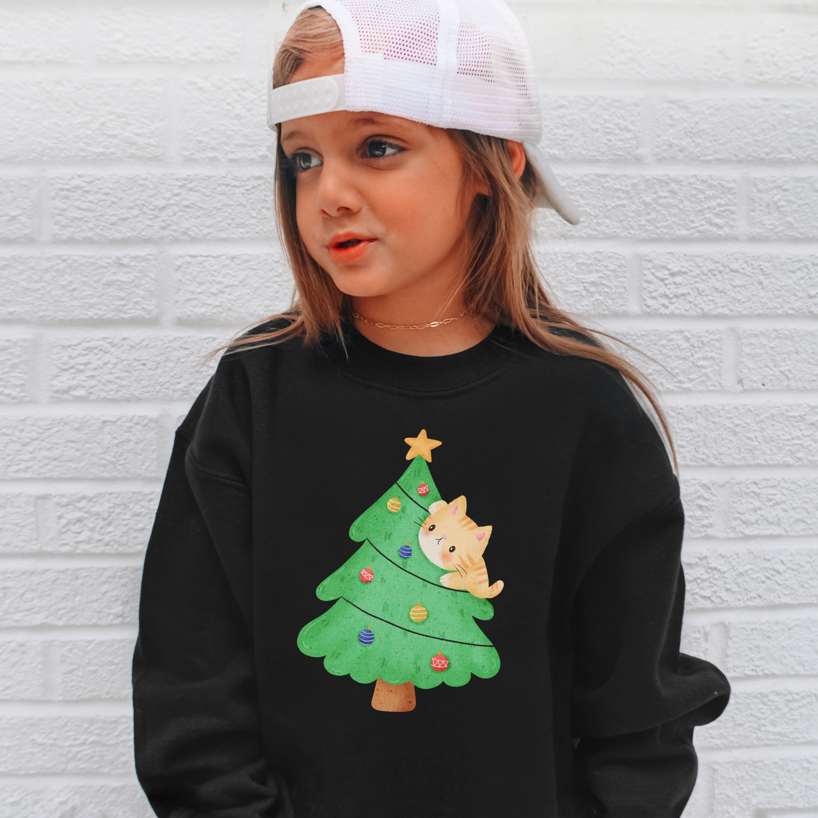 Kids black sweatshirt with colorful cartoon christmas tree and orange cat design for holiday toddlers and youth