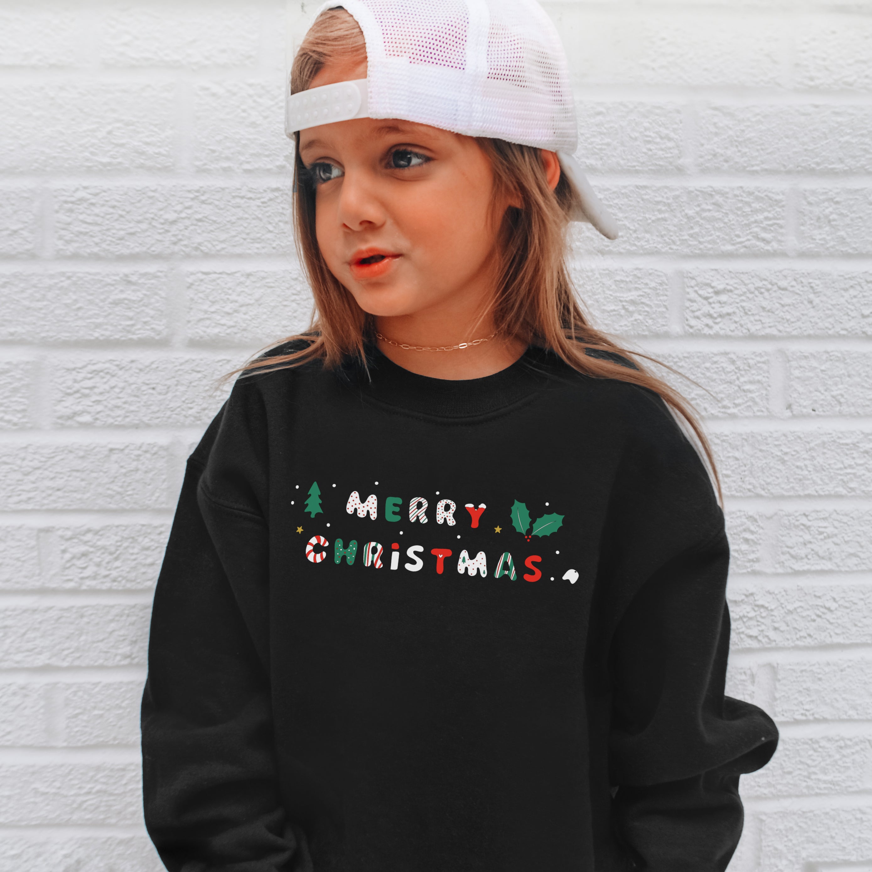 Black long-sleeved kids merry christmas sweatshirt with colorful festive holiday graphic and cute letter design