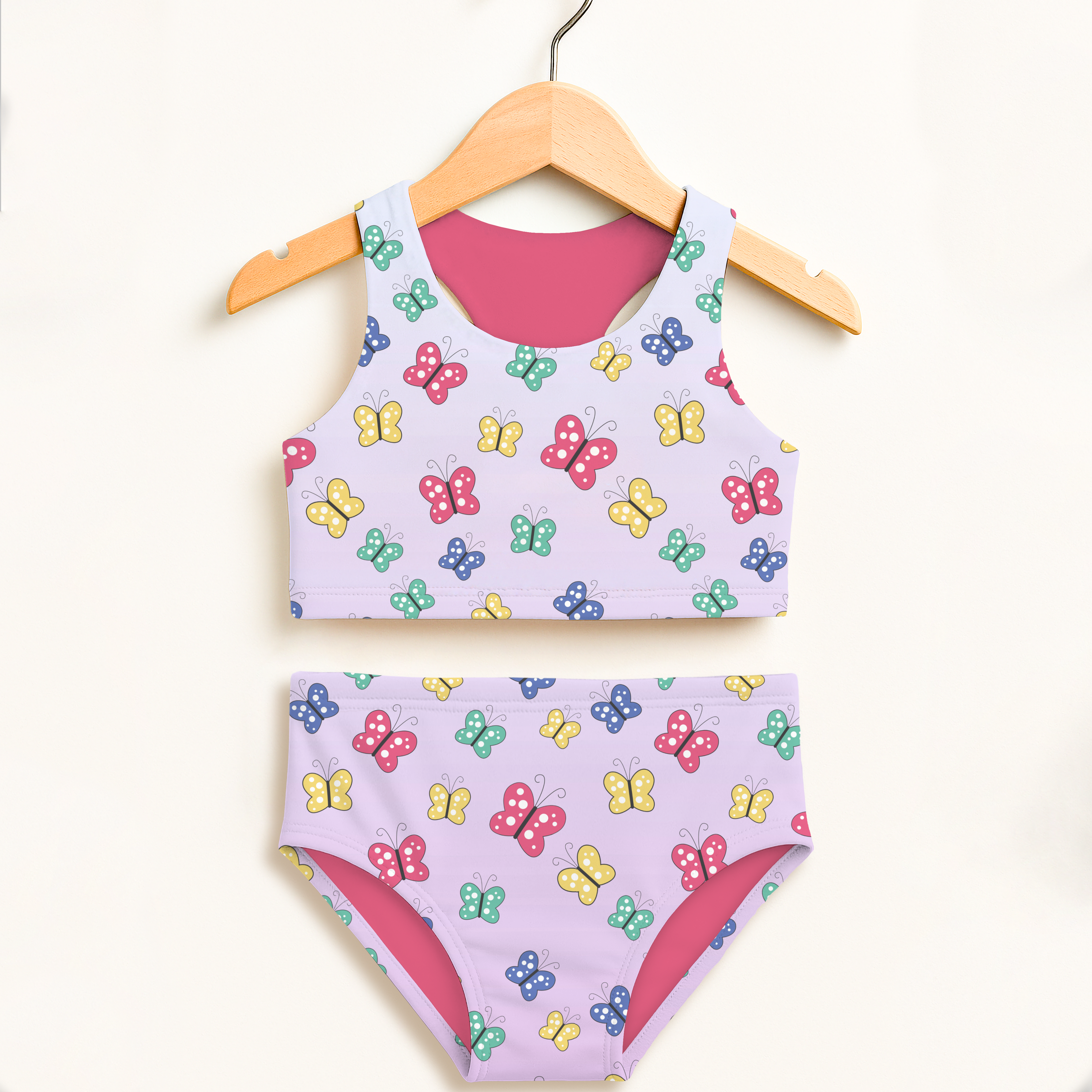 Pastel lavender butterfly-print two-piece swimsuit with pink lining featuring double layered UPF 50+ high waist design