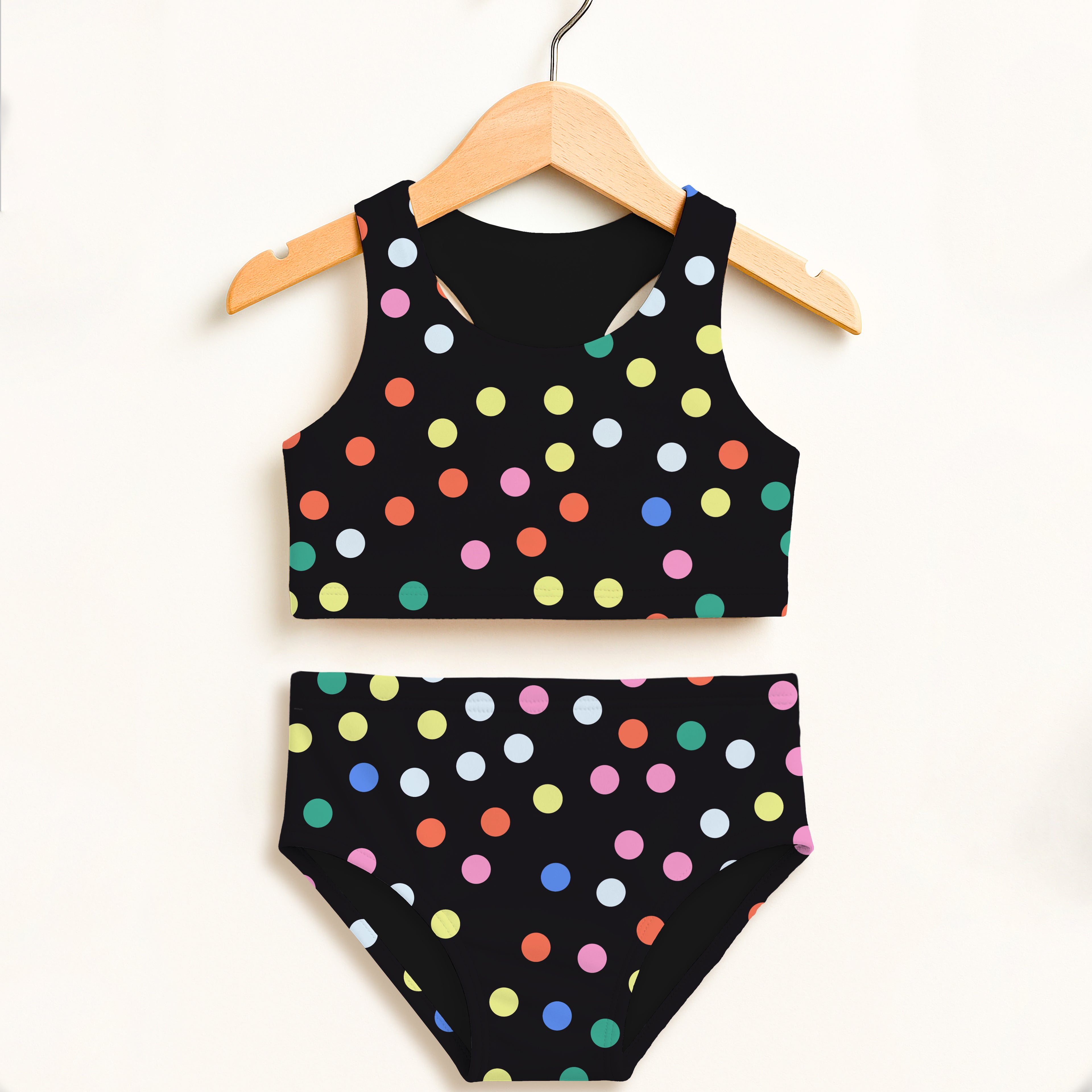 Black polka dot two-piece swimsuit with colorful pink yellow blue green orange dots and upf 50+ high waisted comfort