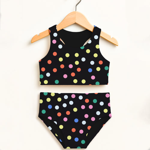 Black polka dot two-piece swimsuit with colorful pink yellow blue green orange dots and upf 50+ high waisted comfort
