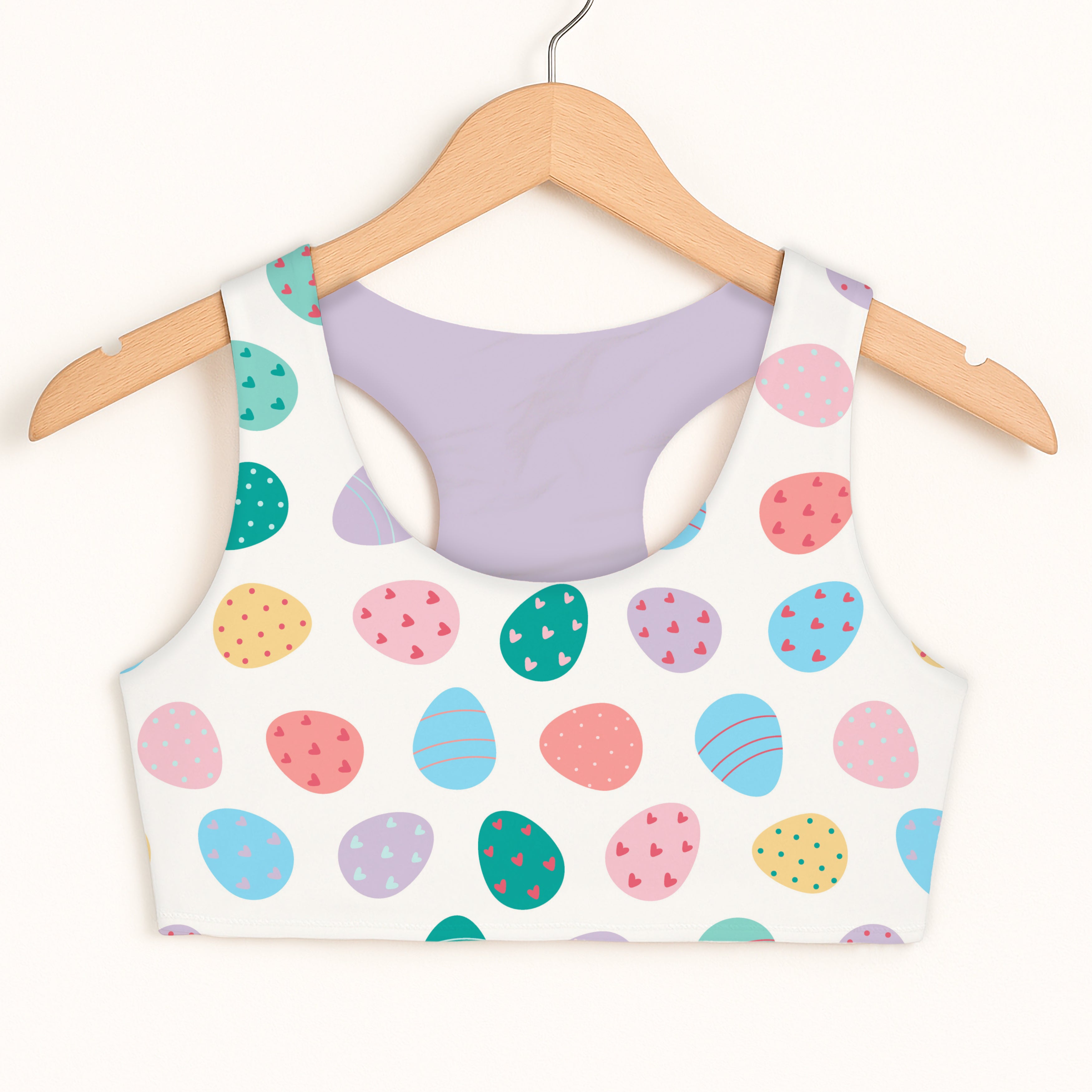 Girls pastel easter egg sports bra white with colorful pastel eggs heart and stripe details quick drying double layered comfort
