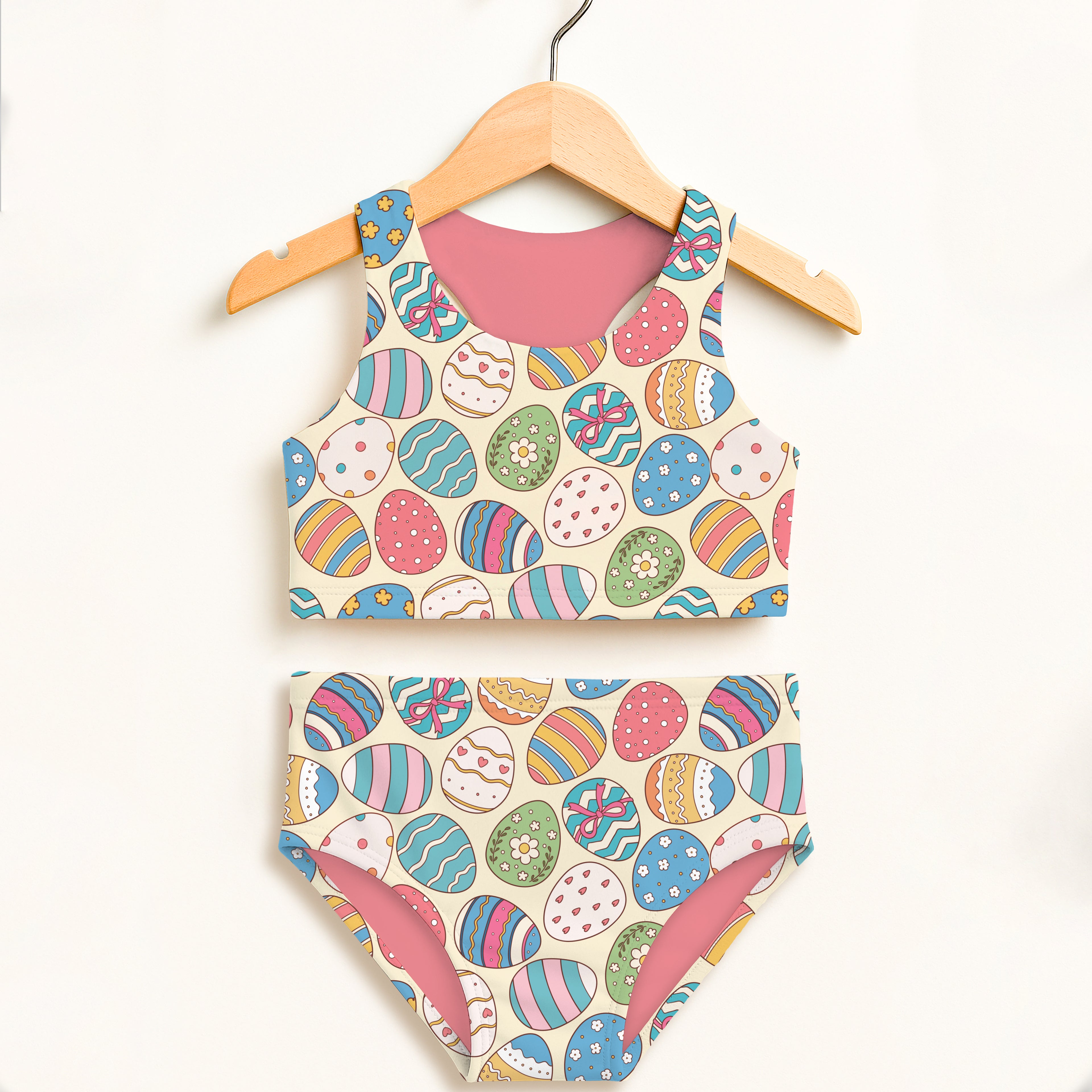Girls colorful easter egg print two piece swimsuit with cream base pink lining and upf 50 plus high waisted comfort