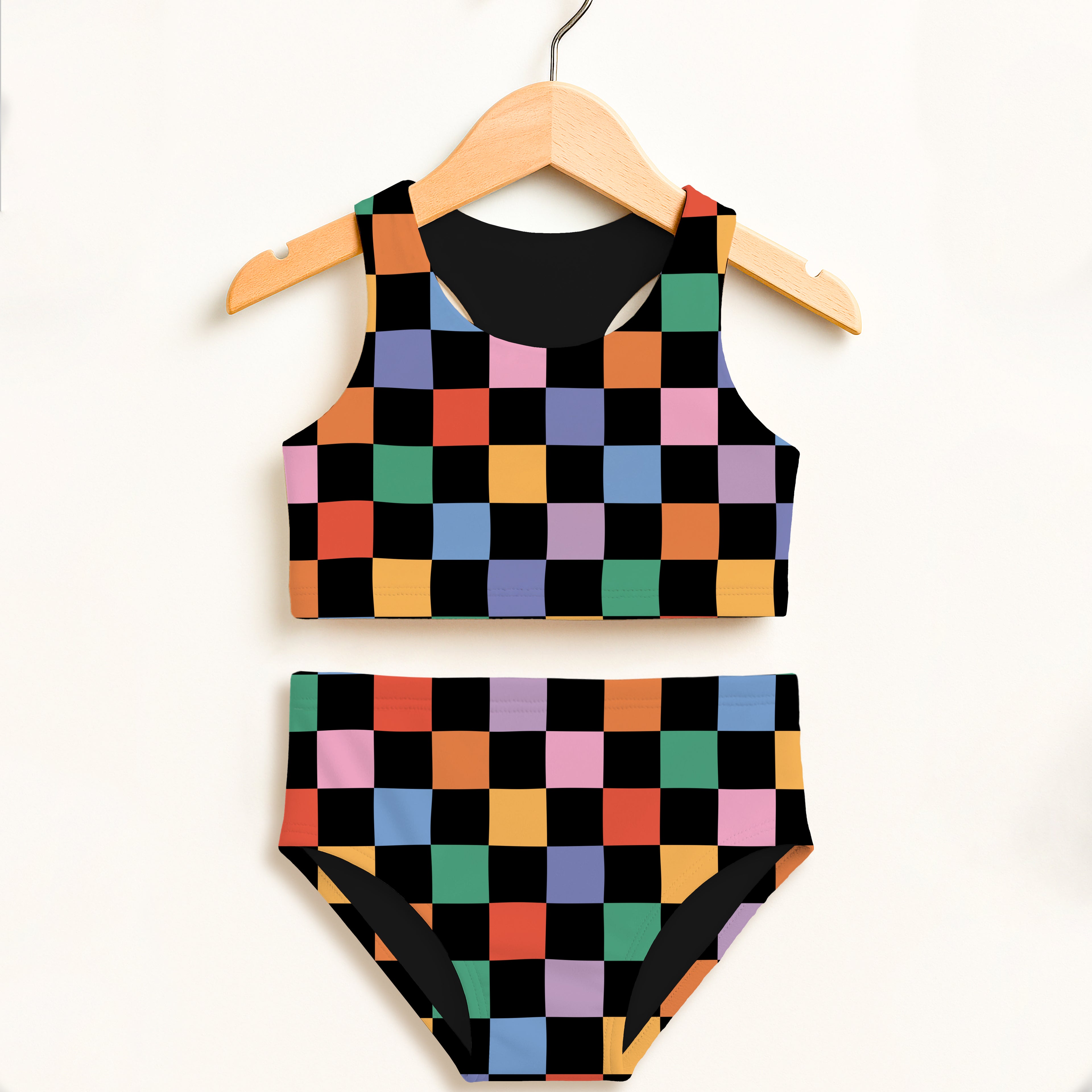 Girls colorful checkerboard two piece swimsuit with black inner lining and high waisted briefs featuring upf 50+ protection