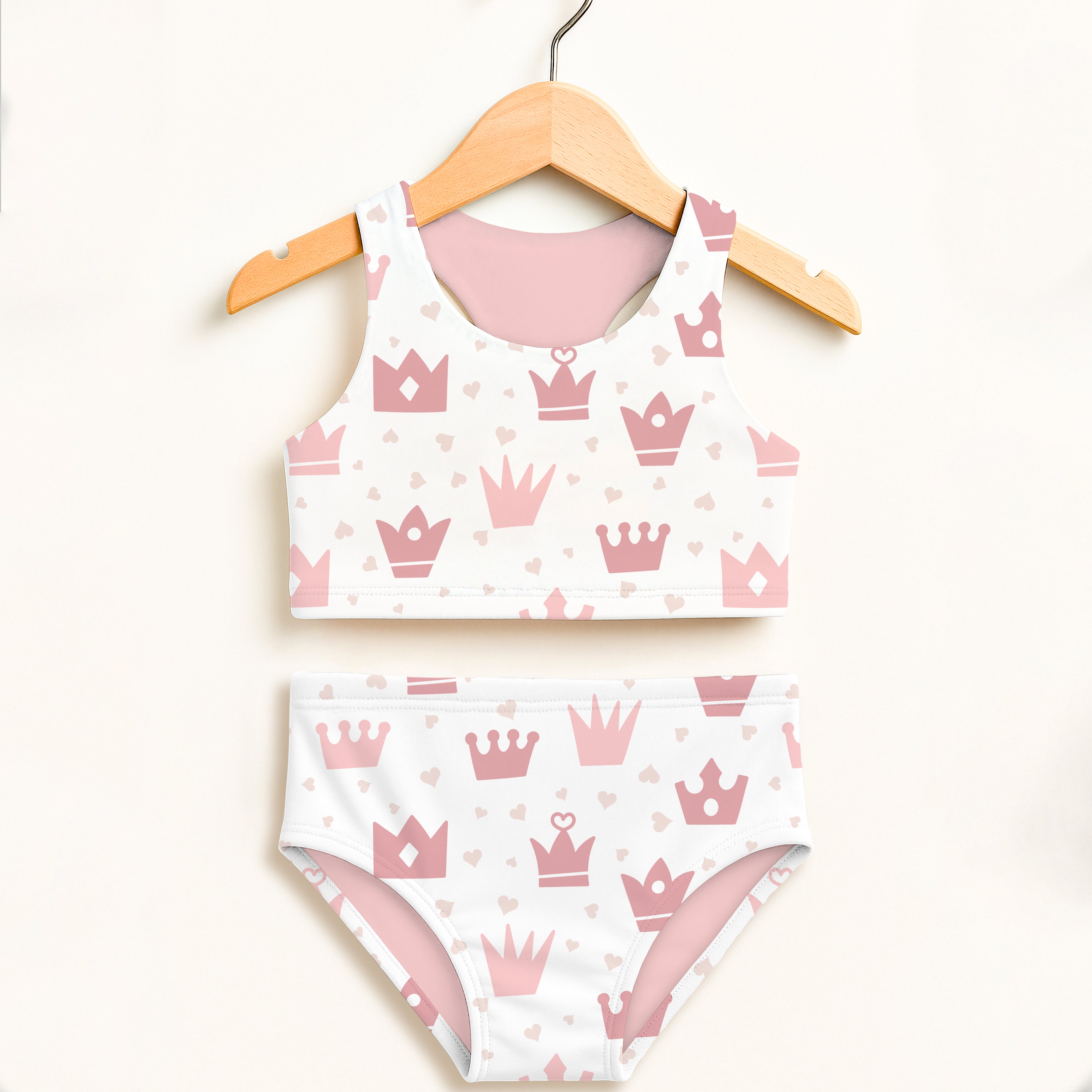 Girls pink princess crowns two piece swimsuit in white and pink with soft stretchy fabric and upf 50 plus protection