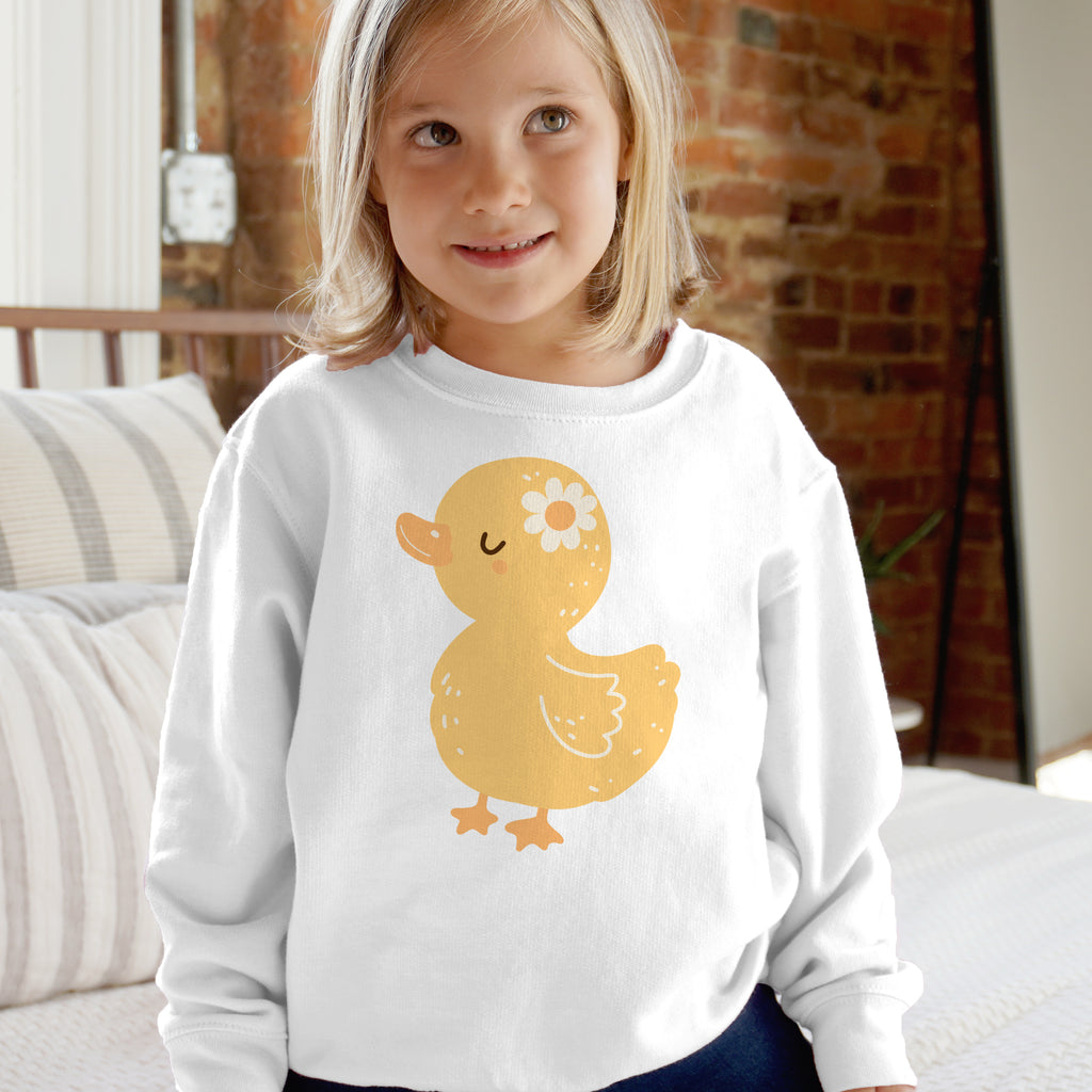 White long-sleeved sweatshirt for kids with a yellow duck graphic and a white daisy on its head