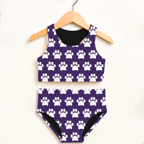 Girls dark purple two piece swimsuit with white paw print pattern black lining and double layered UPF 50 plus fabric