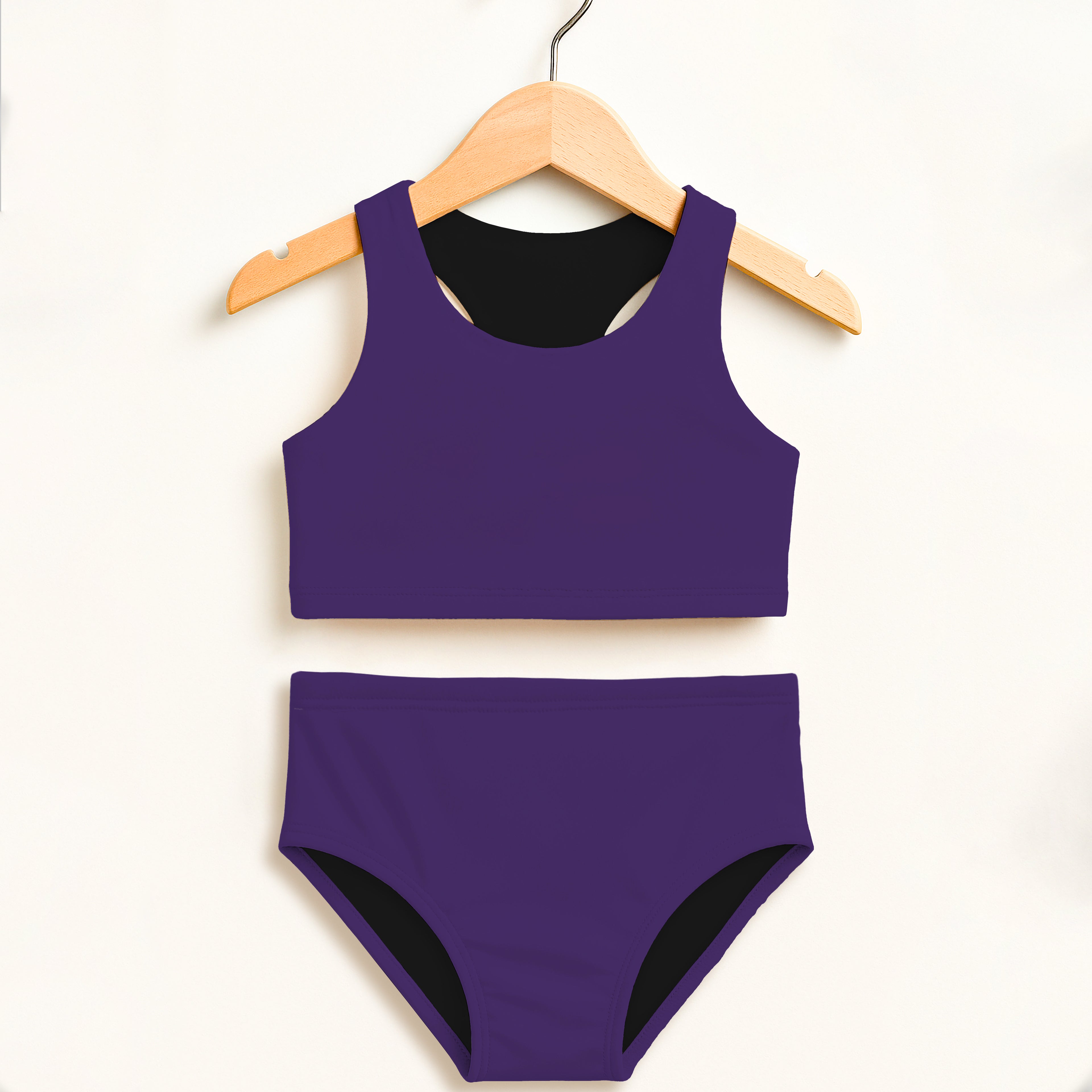 Girls dark purple two-piece swimsuit with black lining halter top and high-waisted double layered UPF 50+ comfort