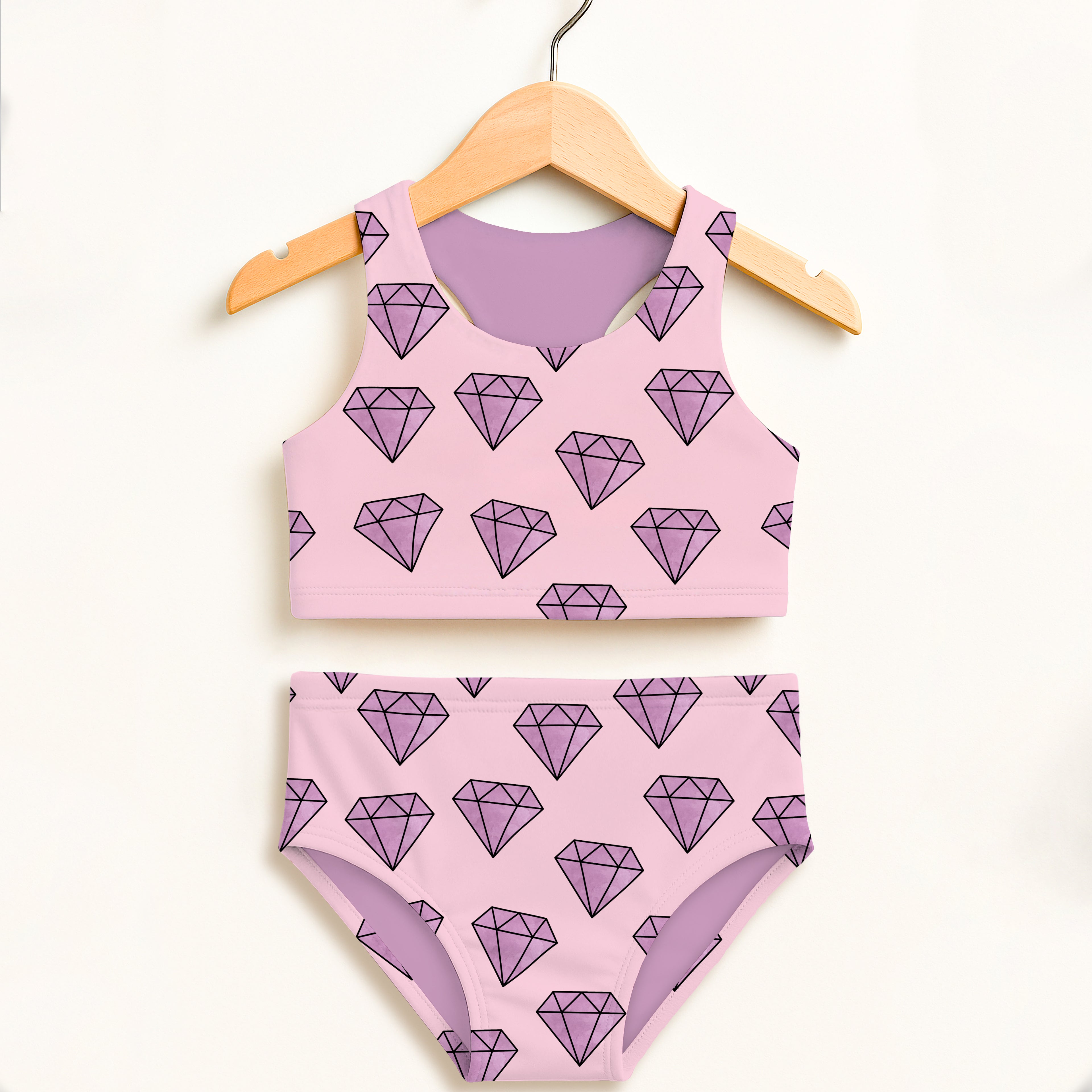Girls purple diamond two piece swimsuit with pink pattern and lavender inner lining featuring UPF 50+ protection