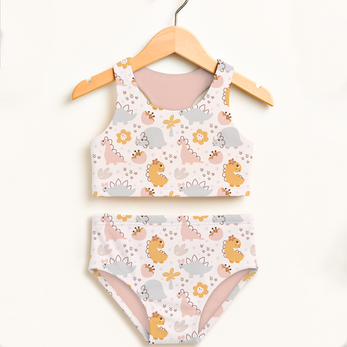 Girls floral dinosaur two piece swimsuit with playful pastel dinosaur print white fabric soft pink lining upf 50+ protection