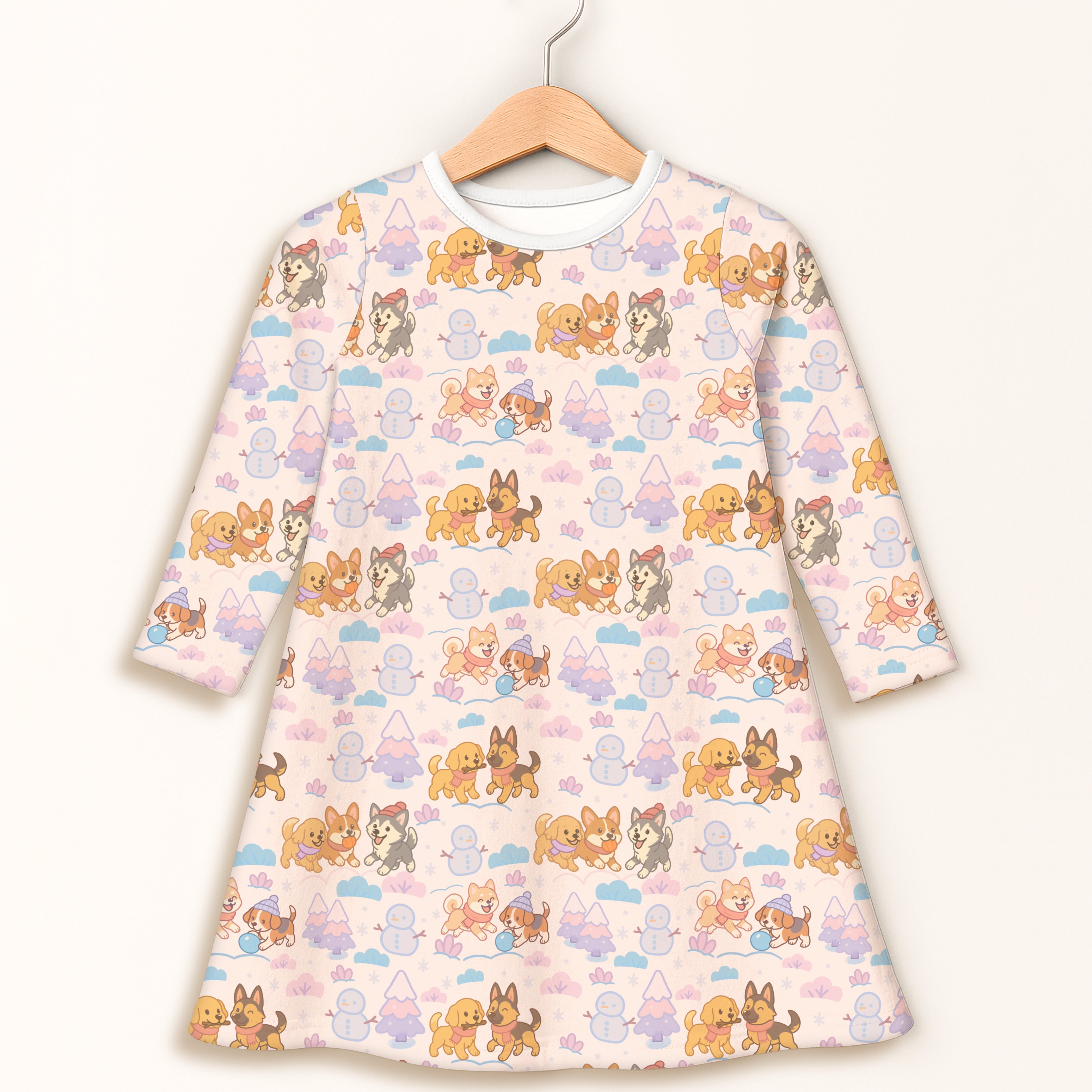 Girls winter puppy long sleeve dress in soft pink with playful cartoon dogs snowmen and mountains pattern