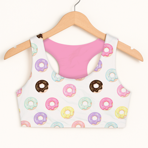 Girls colorful donuts sports bra in white with pastel donut pattern, chocolate glaze, pink lining, quick drying and double layered