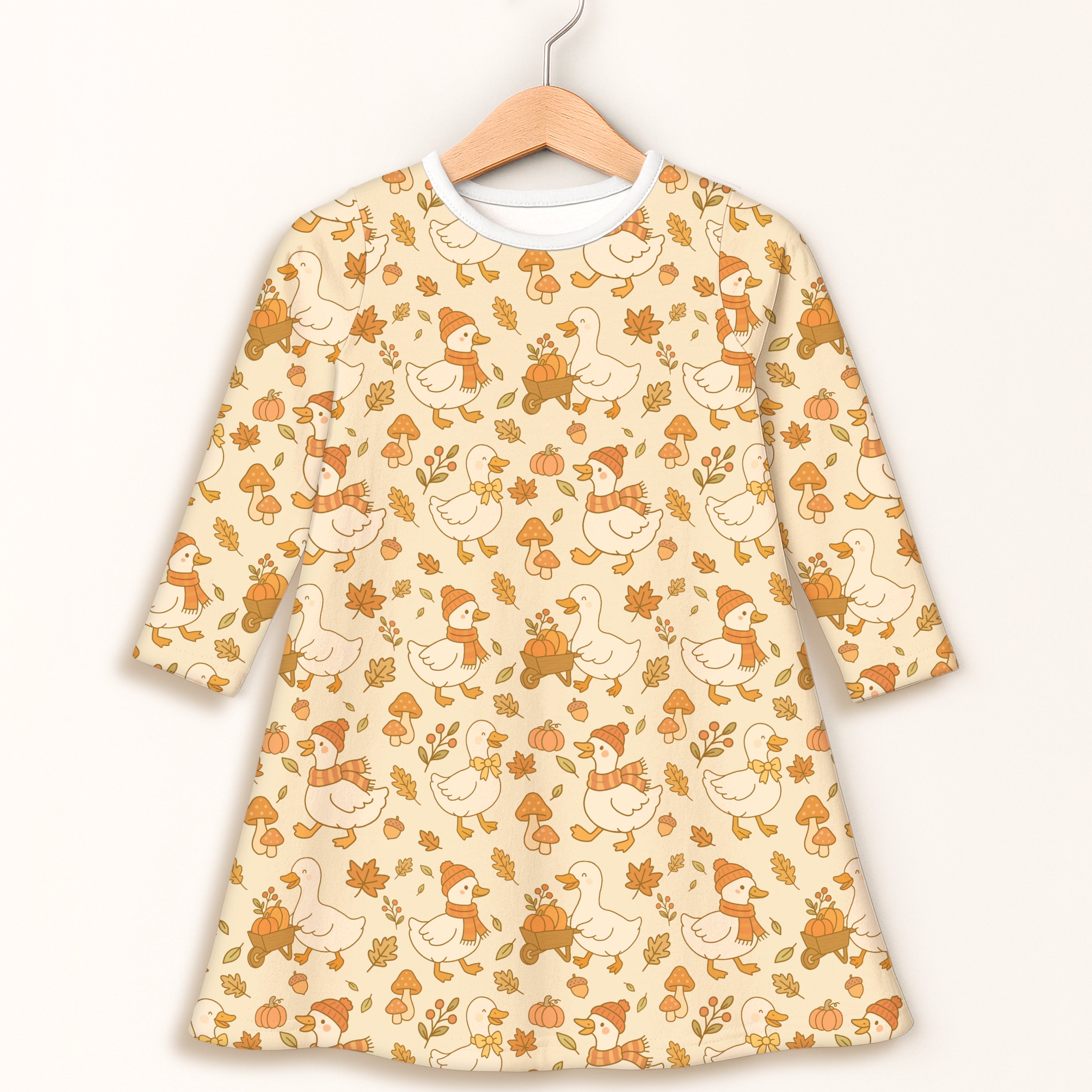 Girls autumn duck long sleeve dress cream color with playful ducks wearing scarves and pumpkins on carts pattern