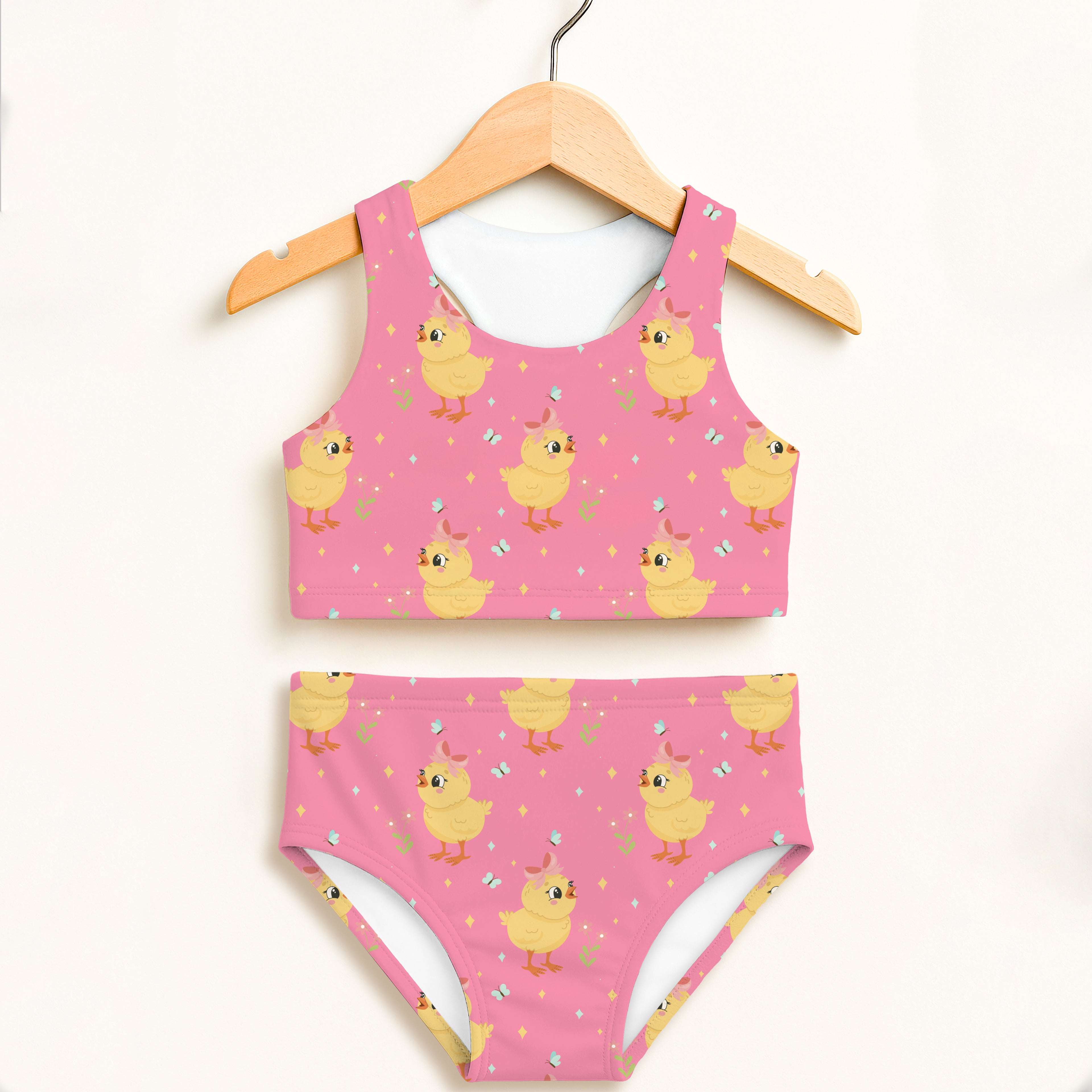 Girls pink chick two piece swimsuit with playful yellow cartoon chicks pattern double layered upf 50 plus high waisted comfort