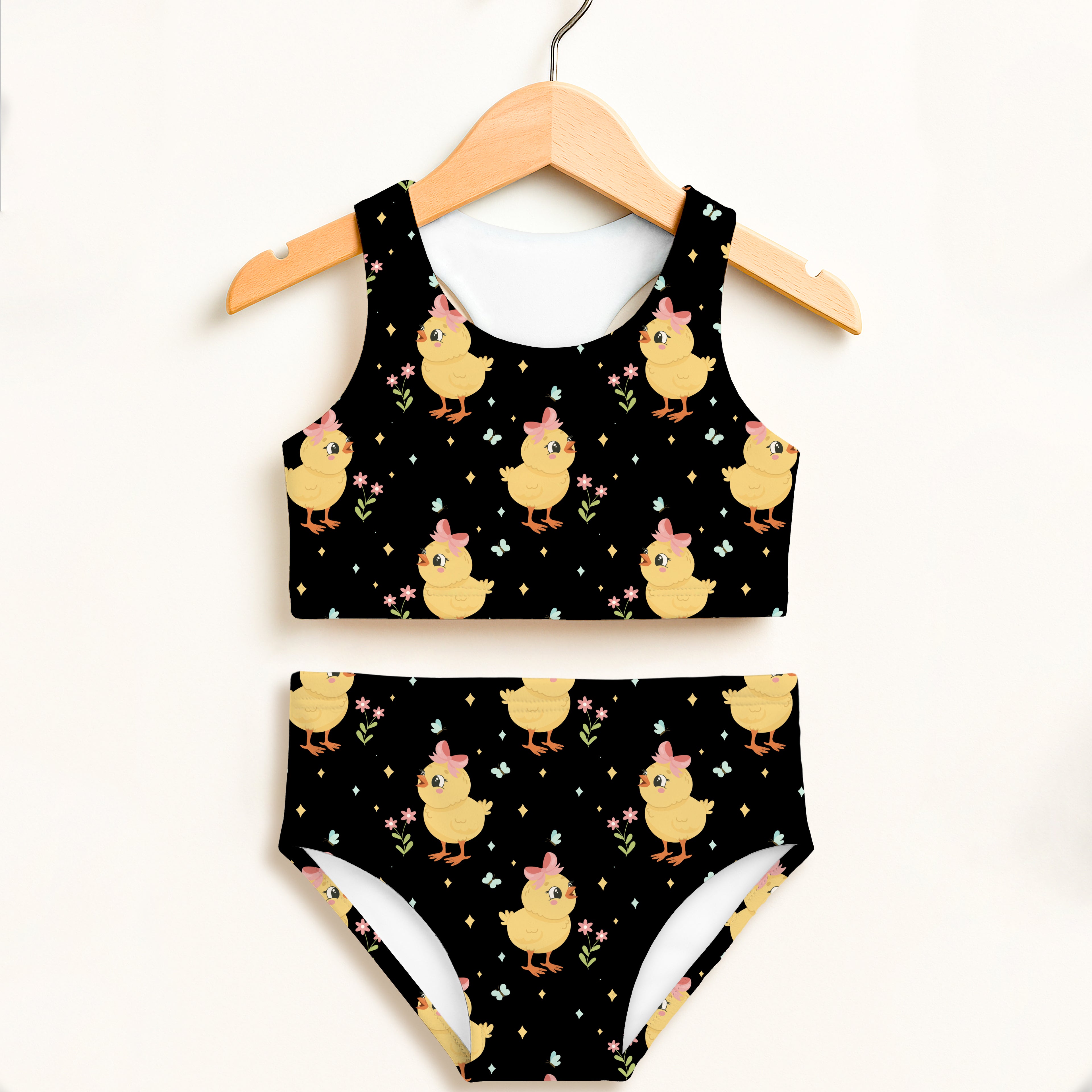 Girls black two-piece swimsuit with yellow cartoon chicks pink bows flowers and sparkles double layered upf 50+ high waisted