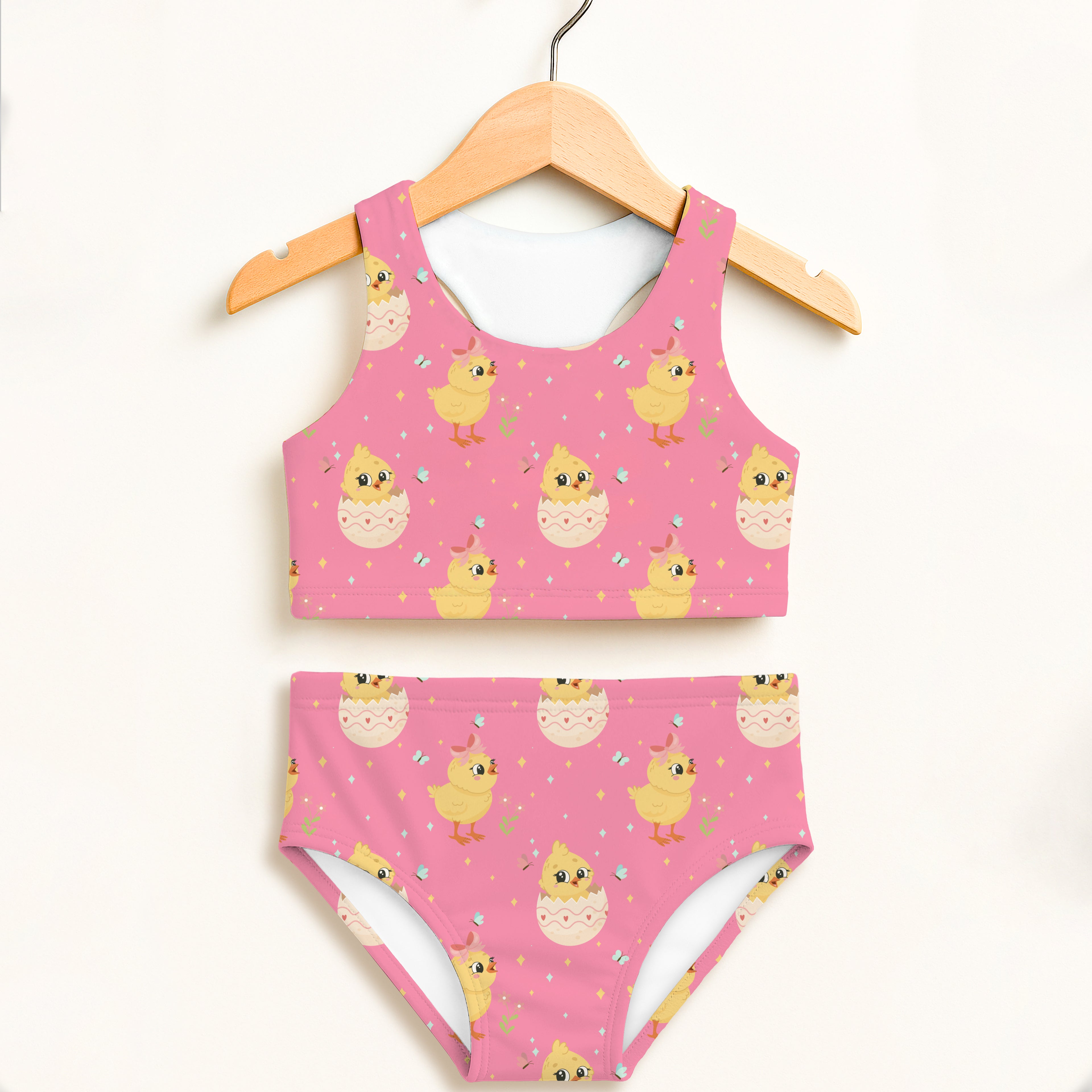 Girls pink chick and Easter egg two piece swimsuit with playful yellow chick pattern and double layered UPF 50 plus fabric