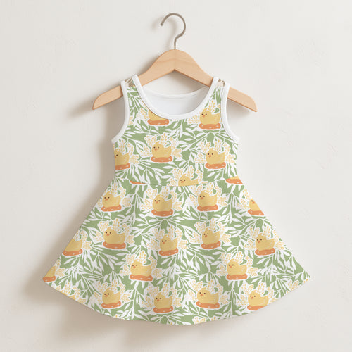 Girls Easter chick sleeveless dress in green and white with yellow rubber duck pattern on orange platforms hanging on wood hanger