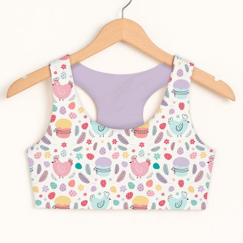 Girls Easter chick sports bra in pastel colors with pink and teal chicken and cupcake pattern quick drying comfort