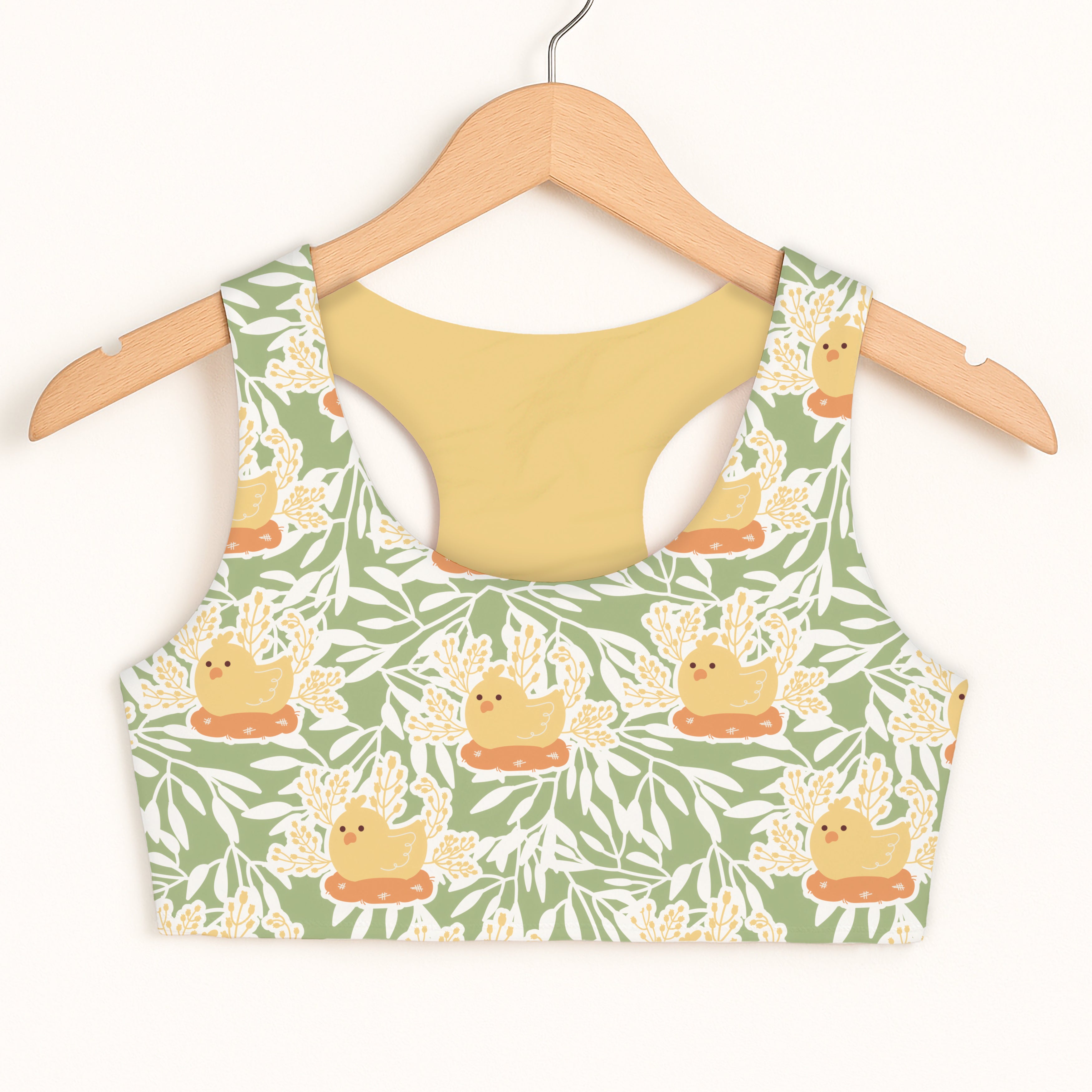 Girls yellow chick sports bra with green and yellow chick pattern made of soft stretchy quick drying fabric