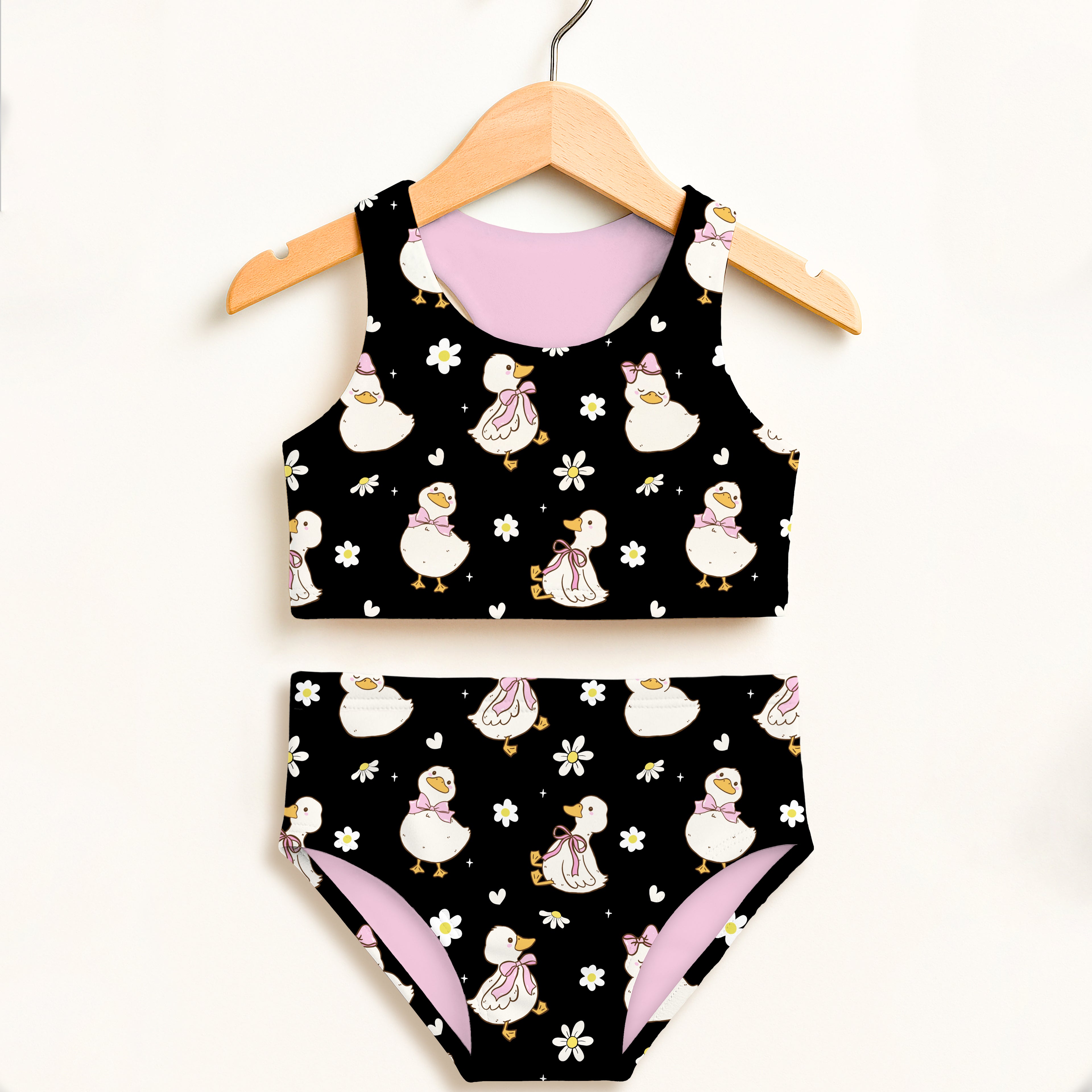 Girls black and pink duck two piece swimsuit with floral accents double layered high waisted UPF 50 plus comfort