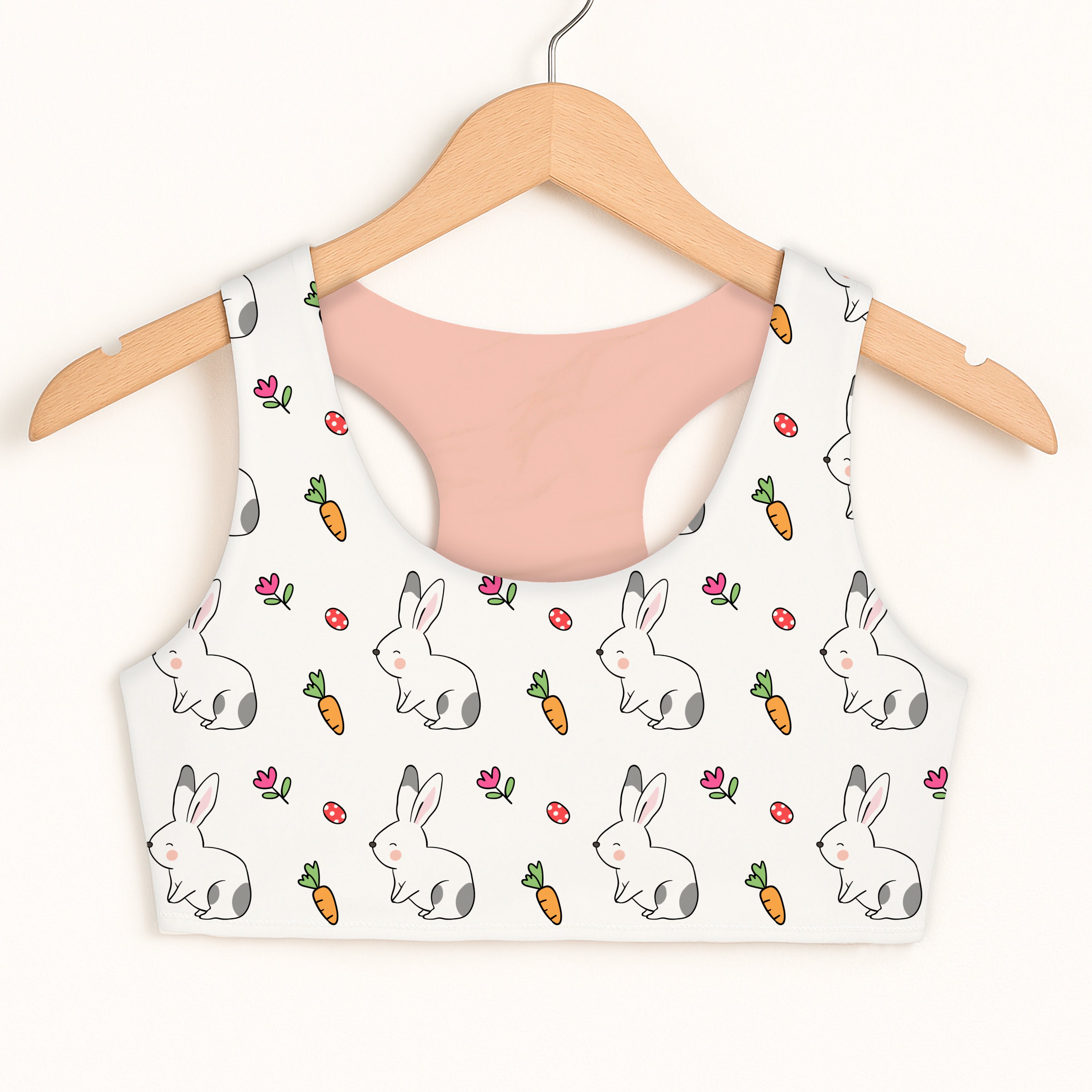 Girls cute bunny sports bra in white with playful cartoon bunny carrot and pink flower pattern made of soft quick drying fabric