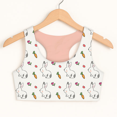 Girls cute bunny sports bra in white with playful cartoon bunny carrot and pink flower pattern made of soft quick drying fabric
