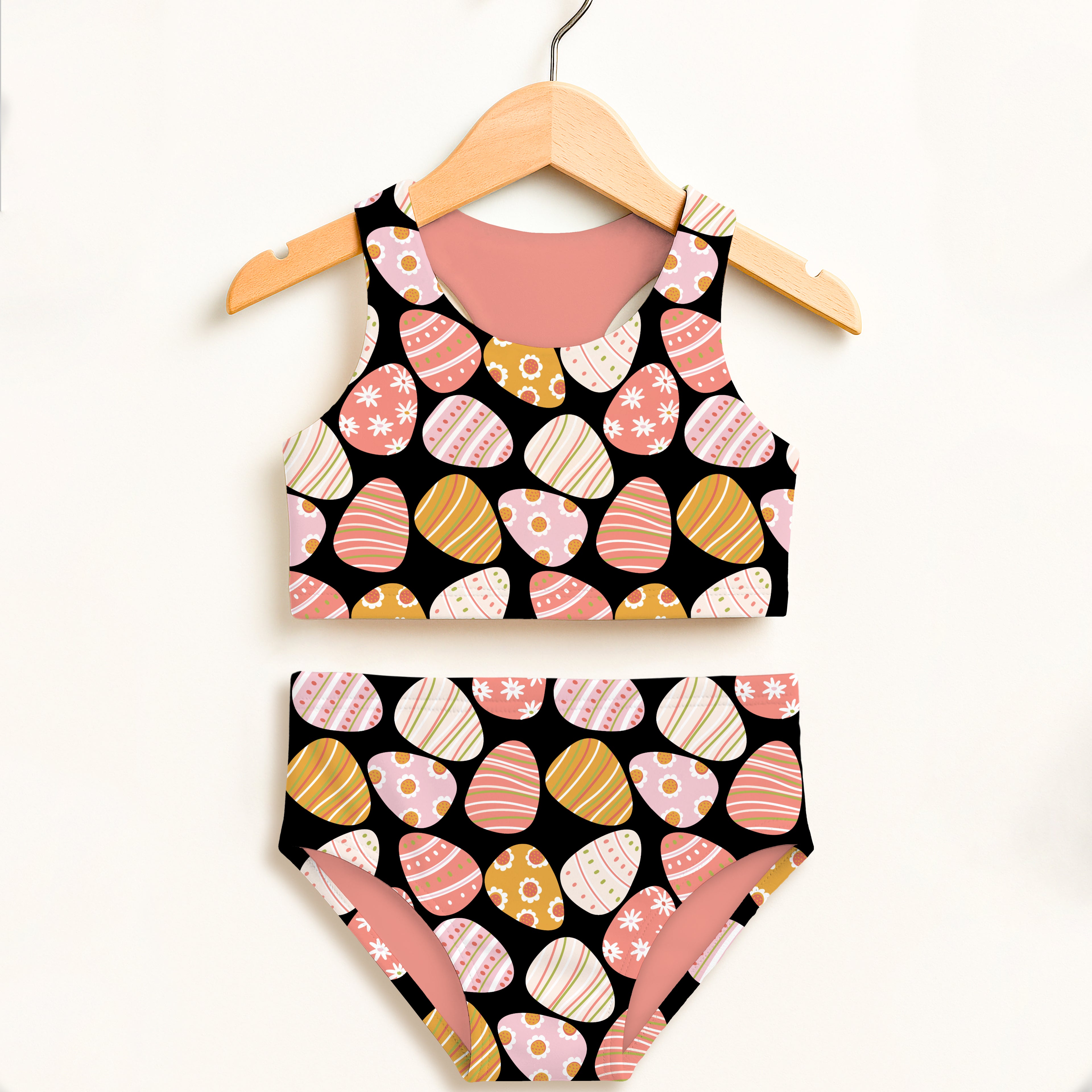 Girls black coral two-piece swimsuit with pastel easter egg pattern double layered upf 50 high waisted comfort