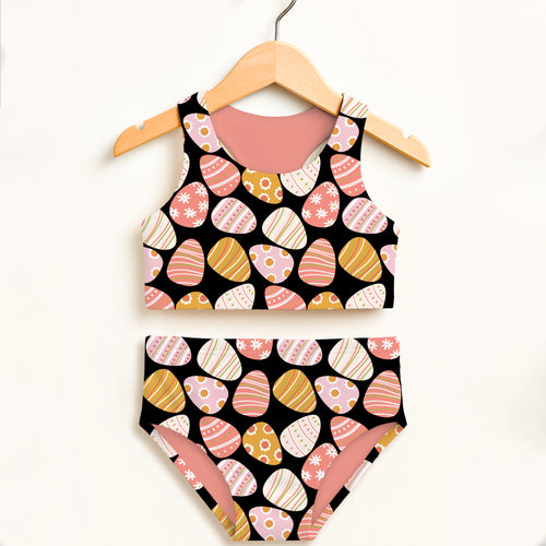 Girls black coral two-piece swimsuit with pastel easter egg pattern double layered upf 50 high waisted comfort